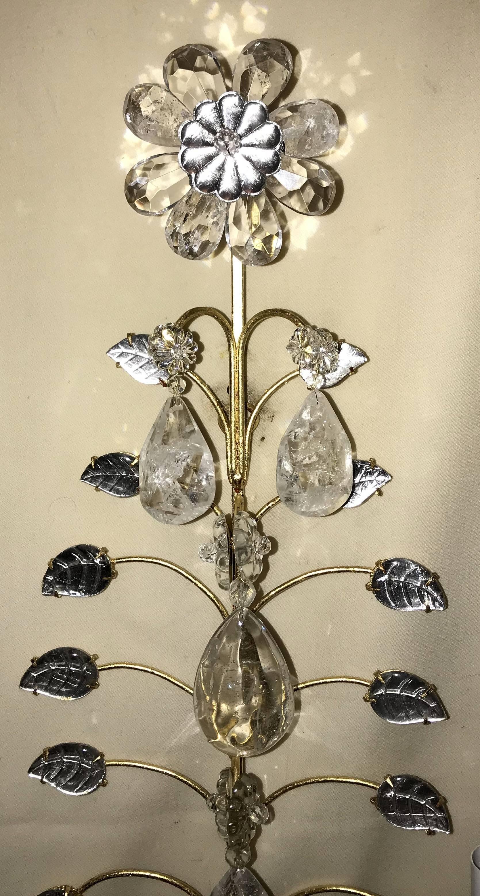 A wonderful Mid-Century Modern vintage pair of Baguès rock crystal gold gilt flower wall sconces.