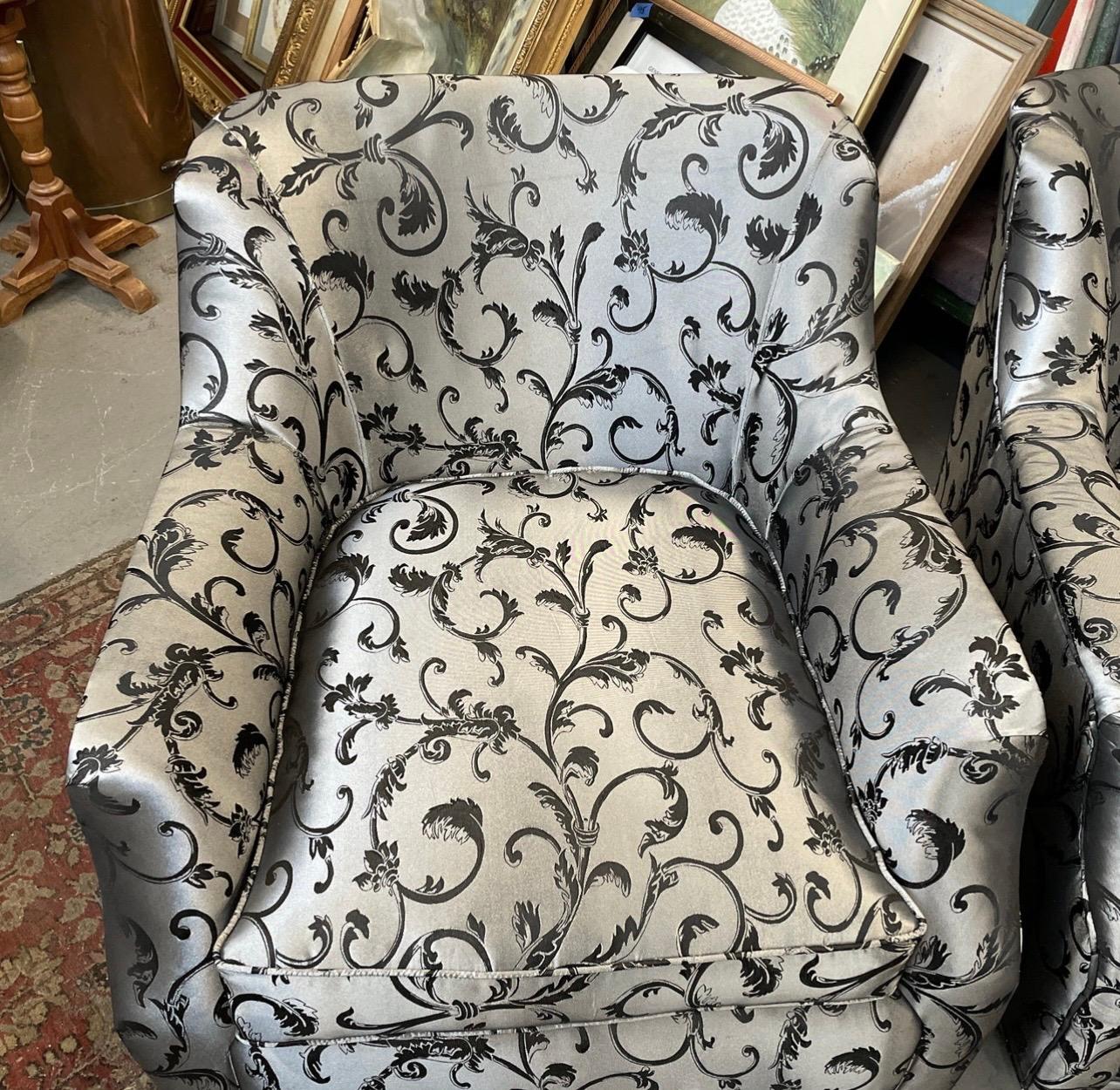 Stunning pair of matching vintage armchairs with caster wheels for ease of movement. However it is the showstopper upholstery that makes this pair a must have.