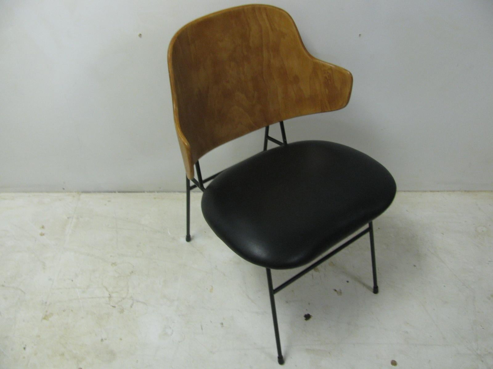 Restored vintage dining-desk chair by Ib Kofod-Larsen stamped made in Denmark. Birch back with repainted iron frame and new plastic feet. New black leather over new padding on seat.