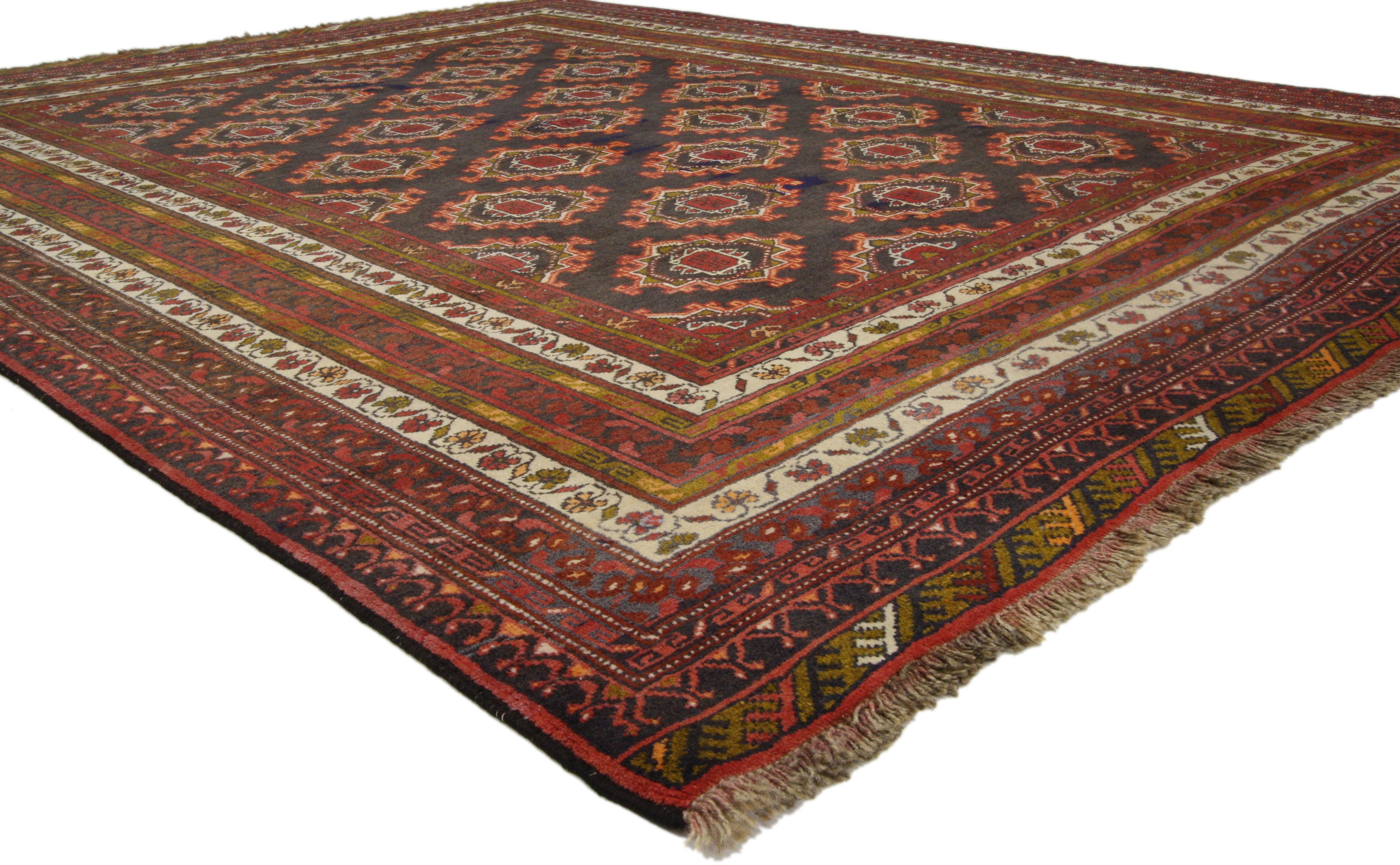 76030 Mid-Century Modern vintage Persian Baluch rug with Tribal style. This hand knotted wool vintage Persian Baluch rug with tribal style features an all-over geometric pattern composed of five vertical columns of repeating gul motifs. A series of