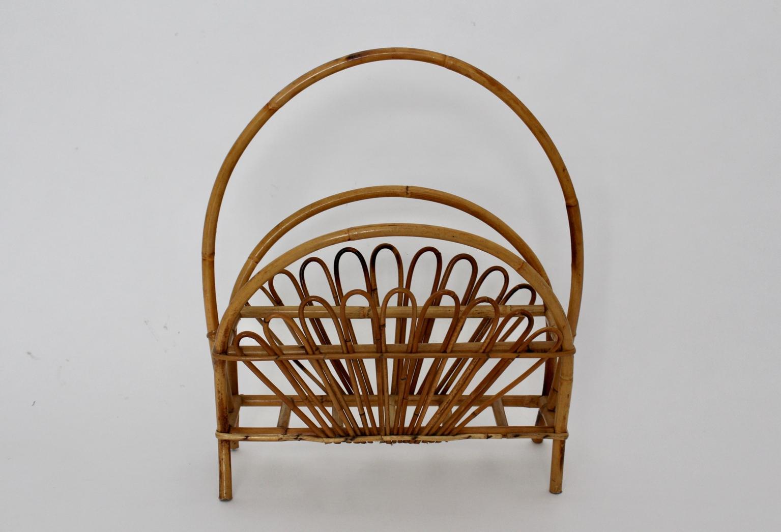 A charming mid century modern Vintage Riviera style magazine rack from the 1950s, Italy, which was made of rattan.

approx. measures:
Width 52 cm
Depth 25.5 cm
Height 60 cm
Very good condition without damages or defects.
    
