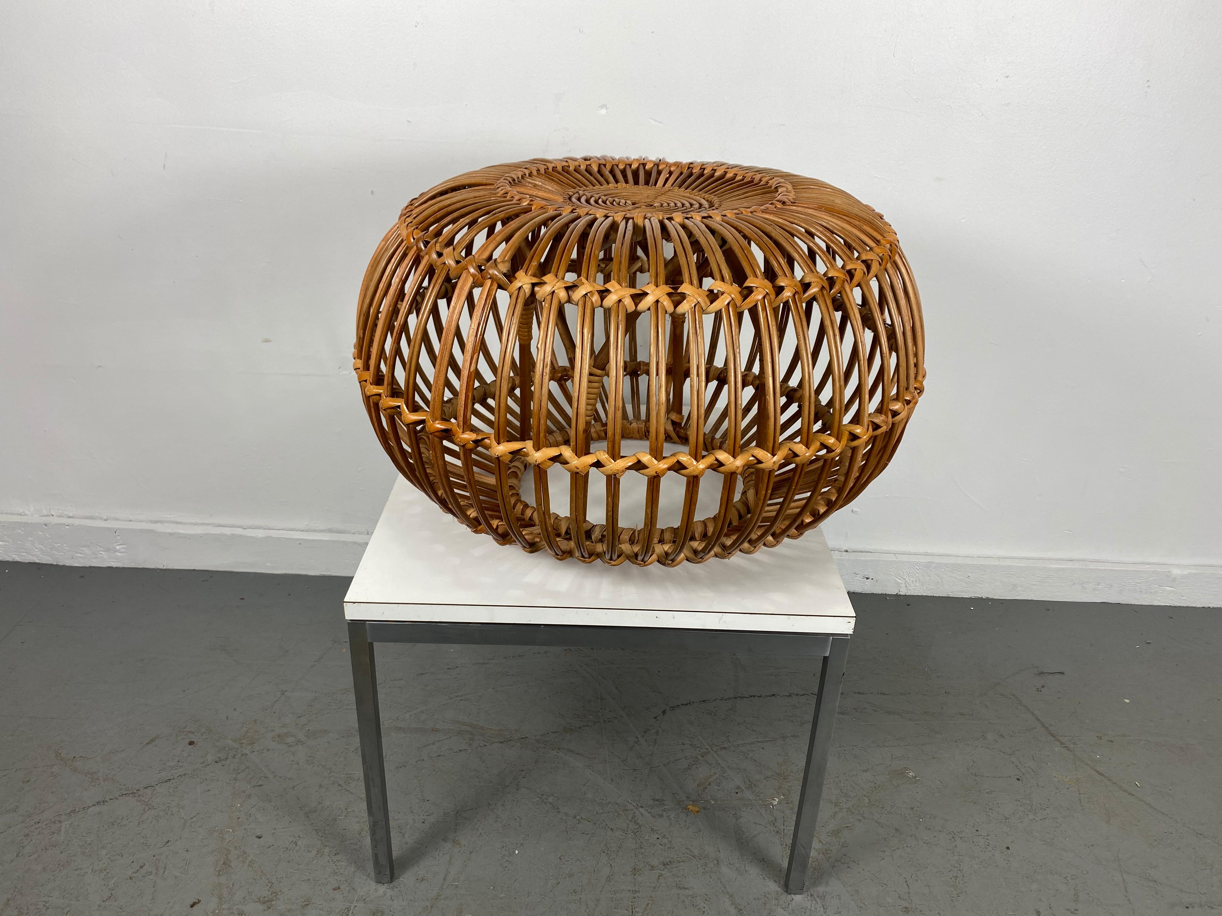 A Mid-Century Modern vintage rattan pouf or stool, which was designed attributed to Franco Albini. Italy 1950s. Very stable, although lightweight. Wonderful original condition.
