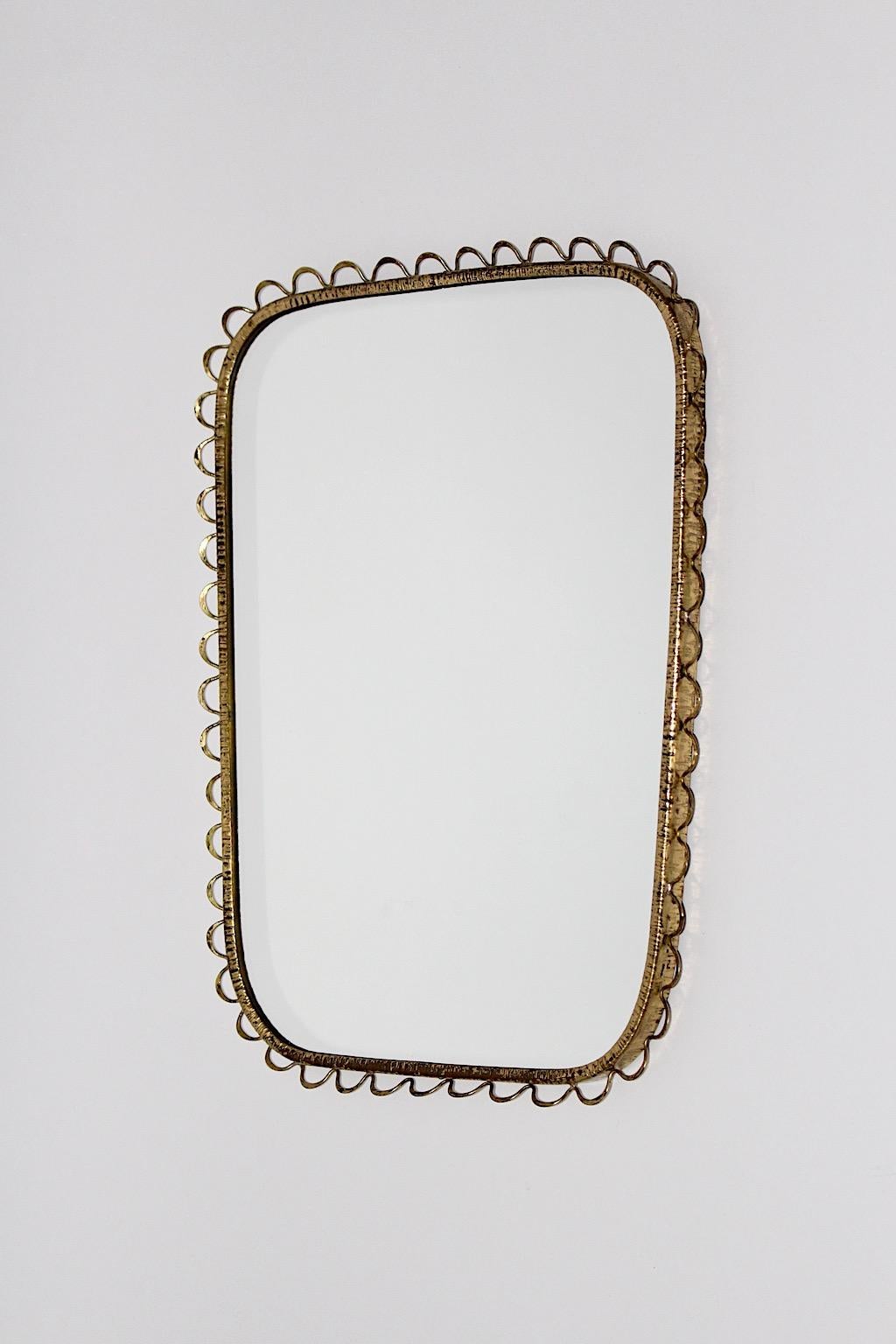 Mid-Century Modern vintage wall mirror rectangular like from brass with small loops 1950s Italy.
A stunning wall mirror rectangular like with brass frame and delicate loops as decor 1950s Italy.
This wall mirror works perfectly near your