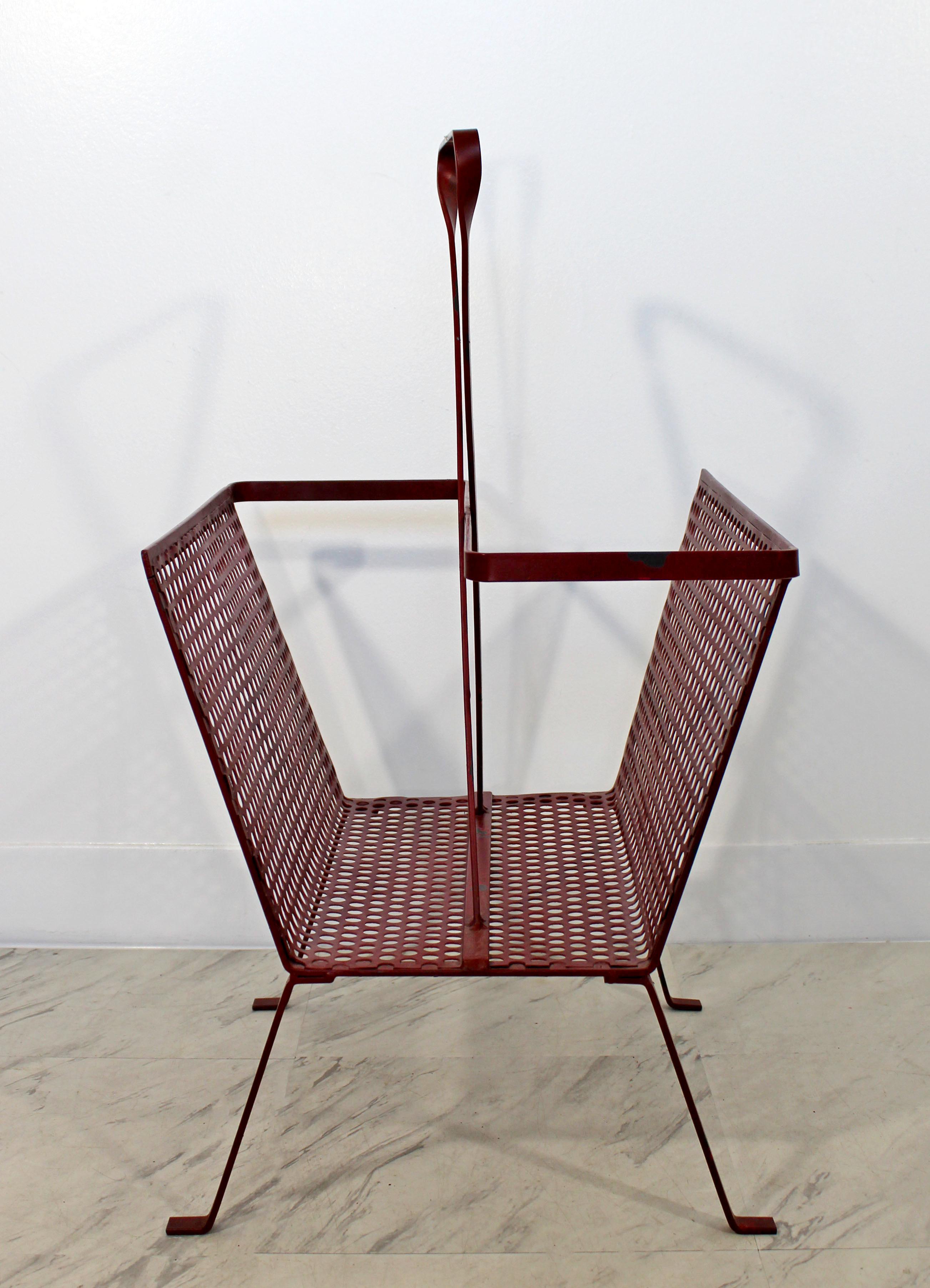 For your consideration is a small, red painted mesh metal magazine rack, in the style of Mathieu Mategot. In vintage condition. The dimensions are 15