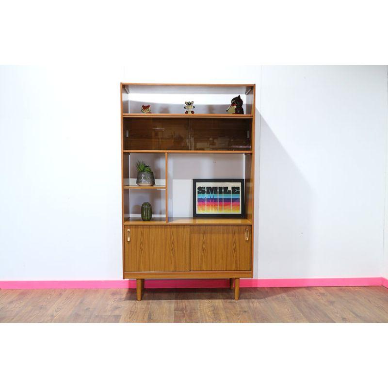 This shelf unit is typical of the Schreiber style, minimal in the danish style with great teak wood grain and distinctive recessed mounted handles.

The Company was one of the biggest names in furniture in the 70s, rivalling G Plan E Gomme and other