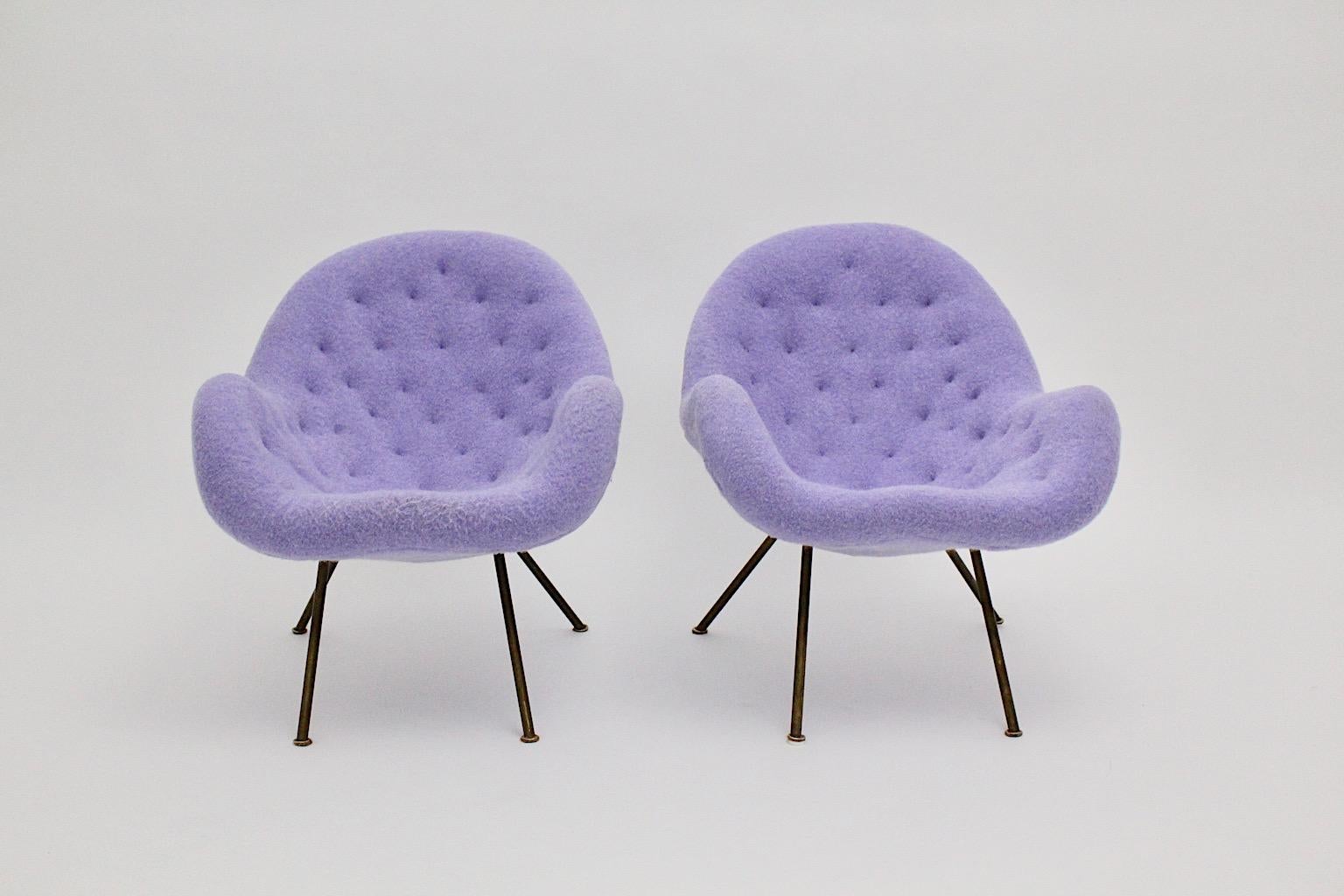 Mid Century Modern vintage lounge chairs or armchairs pair duo covered with soft pastel lilac mohair fabric 1950s  Germany.
A pair of beautiful lounge chairs with brass feet and a cover from soft pastel lilac mohair fabric. 
The very comfortable