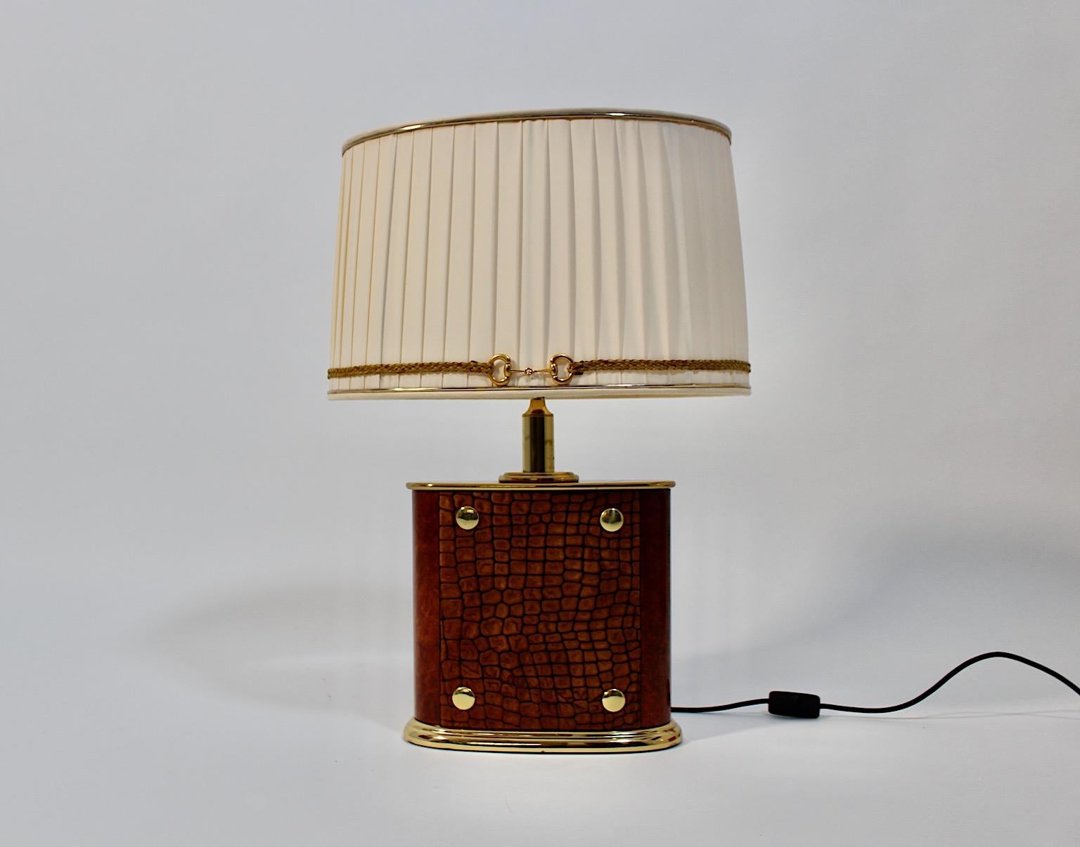 Mid Century Modern vintage table lamp from brass and brown suede and plastic with a new handmade lamp shade in its original form by Paolo Gucci for 
Form Italia 1960s Italy.
An extraordinary and sophisticated table lamp designed by Paolo Gucci 1960s