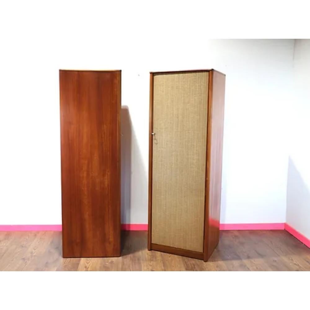 Add a touch of unique style and functionality to your space with these Mid Century Modern Vintage Teak and Rattan Armoire Wardrobes. The combination of teak and rattan give this piece a beautifully delicate yet sturdy aesthetic. The single armoires