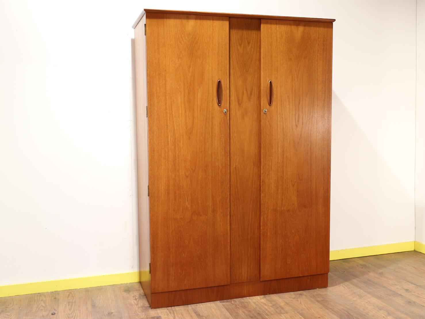 A fantastic Mid-Century Modern armoire by British furniture maker Homeworthy from the 1960s. A great storage space with hanging rail this wardrobe would look great in any bedroom 

 

Dimensions 

w48.5 d21.5 h70 

 

Condition

