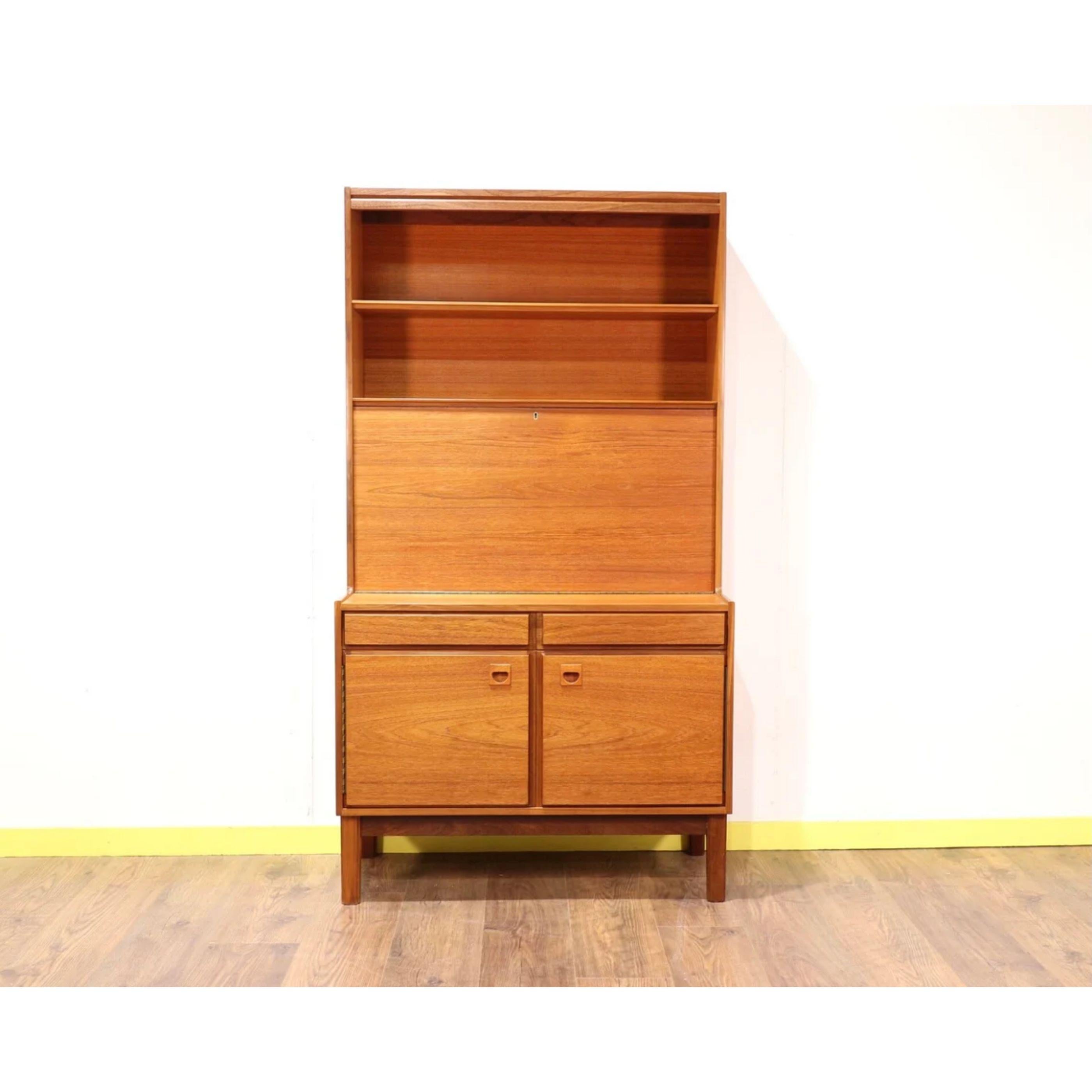 This gorgeous mid century bureau designed by Peter Hanson for Vanson is a real statement piece as well as being very practical. In this new world when working from home is the normal it makes an excellent desk to work at with shelves for storage as