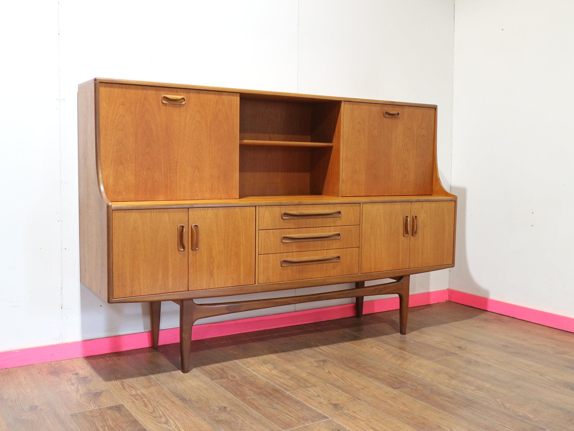 Enhance your living space with this fantastic tall Mid Century credenza by G Plan, part of the sought-after Fresco range. With its sleek, timeless design and great style, it offers lots of storage, making it both beautiful and practical. Crafted