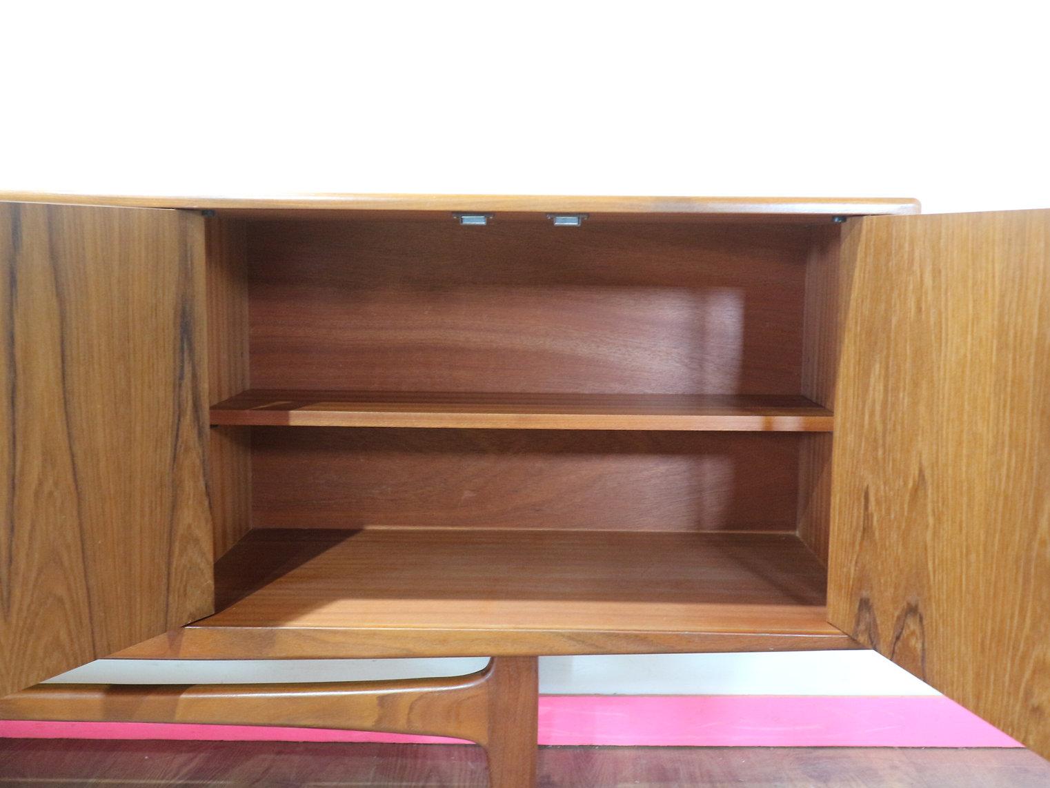 This fabulous G Plan credenza is part of the Fresco range and designed by V B Wilkins around 1965. A classic British piece with Danish style, it has become one of the most popular credenzas made by G Plan, a real statement piece. Featuring two large