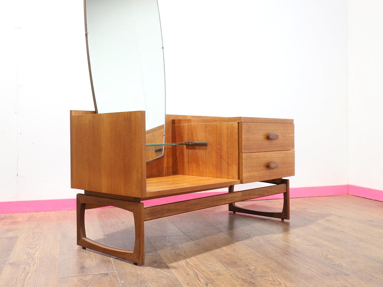 A gorgeous entranceway table by G Plan as part of their Quadrille range, this piece exudes great style and timeless elegance. Crafted from rich, durable teak, it effortlessly combines functionality with mid-century modern aesthetics, making it a