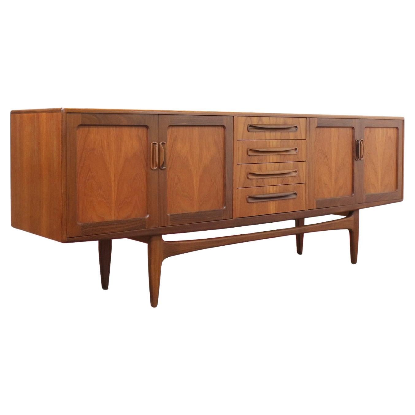 This fabulous G Plan credenza is part of the Fresco range and designed by V B Wilkins around 1965. A classic British piece with Danish style, it has become one of the most popular credenzas made by G Plan, a real statement piece. Featuring two large
