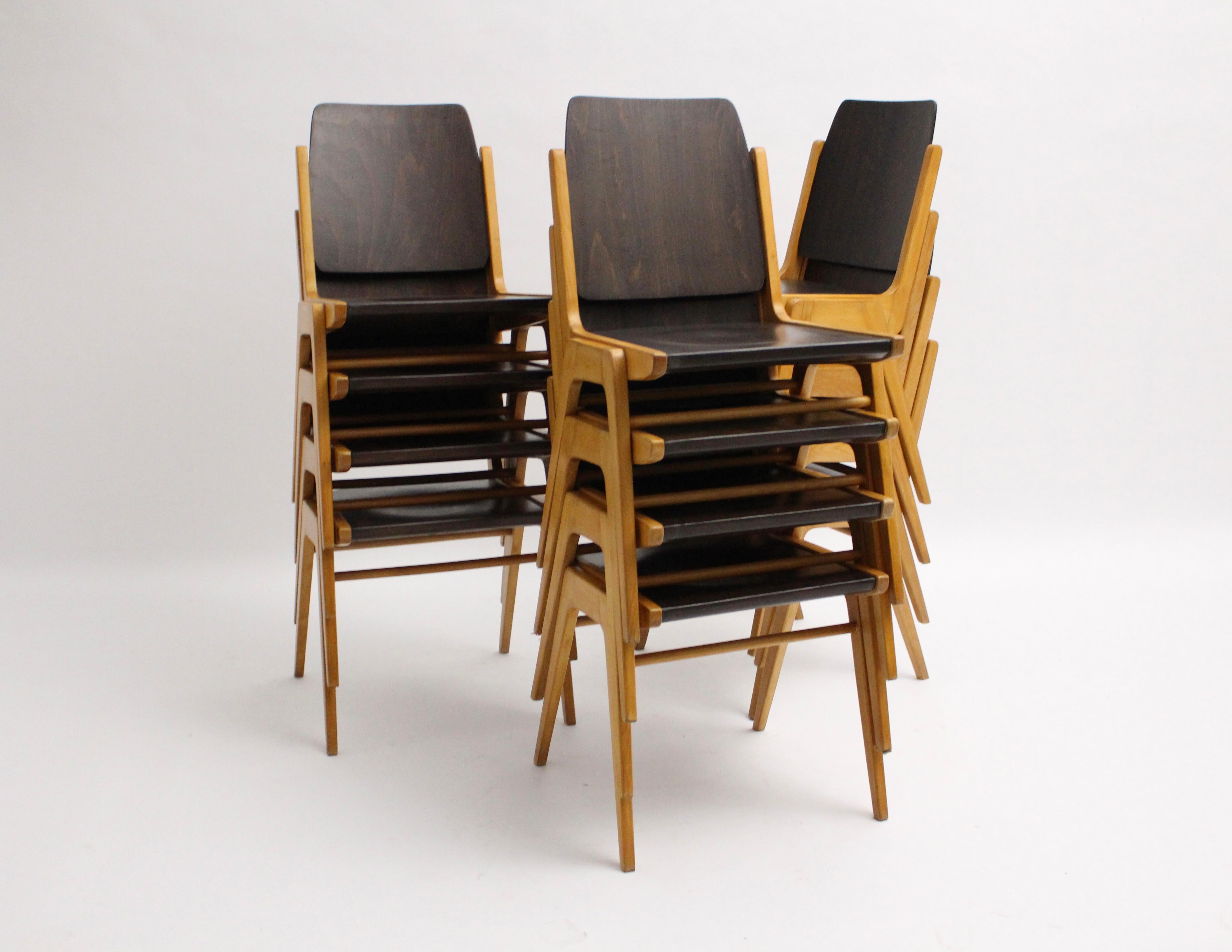 Mid Century Modern set of ten ( 10 ) stackable bicolored dining room chairs designed by Franz Schuster (1892-1972) for the Forum Stadtpark Graz 1959, model Austro Chairs, and executed by Wiesner - Hager, Austria.
Franz Schuster, a famed Austrian