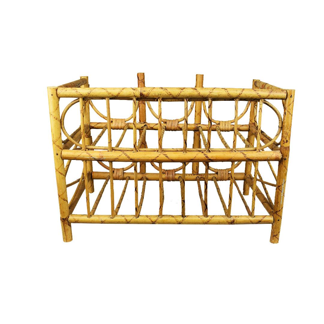 A handmade Mid-Century Modern wine rack created from bentwood bamboo and wicker. Two layers of bamboo are carefully woven together creating a space for 6 bottle so wine (or other beverages in similar shaped bottles) to rest on. The back features