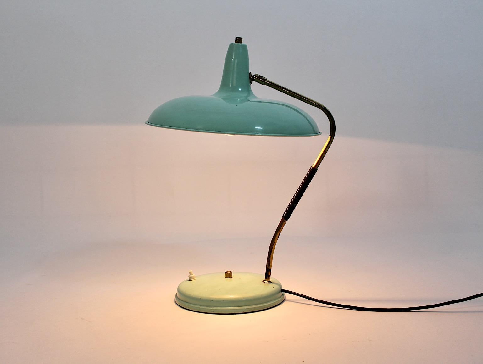 Mid-Century Modern vintage teal turquoise table lamp or desk lamp from metal and brass, 1950s Italy.
A wonderful table lamp or desk lamp by Stilnovo made from metal and brass details in pastel blue or turquoise color tone, 1950s Italy.
This table