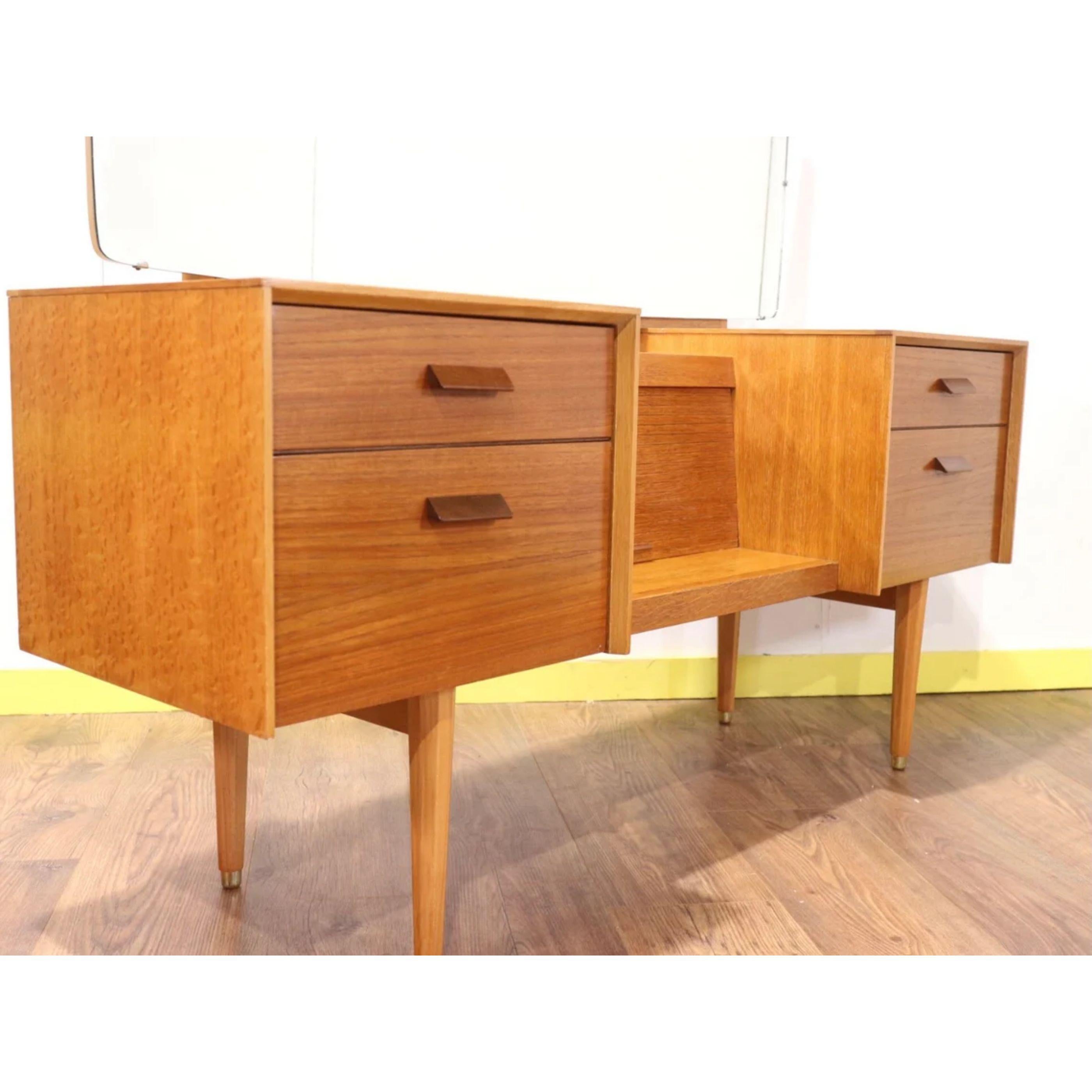 A beautiful and stylish vanity unit by British furniture maker Meredew
A super stylish tambour door storage cabinet sits in the middle and the sculpted handles really set this piece apart.

Dims

w54.5 d16.5 h to top of vanity 24.5 / to top of