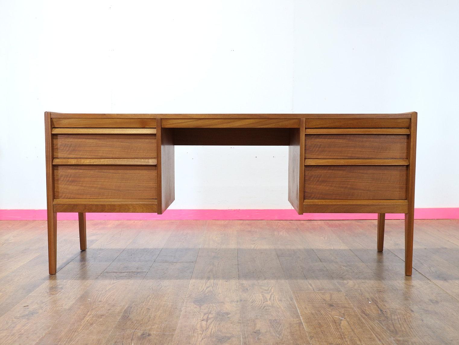 Discover the elegance of the Mid Century vanity by British furniture maker Younger, now available at Mid Century Traders. This exquisite piece features a stunning grain that showcases the craftsmanship Younger is renowned for. Versatile in function,