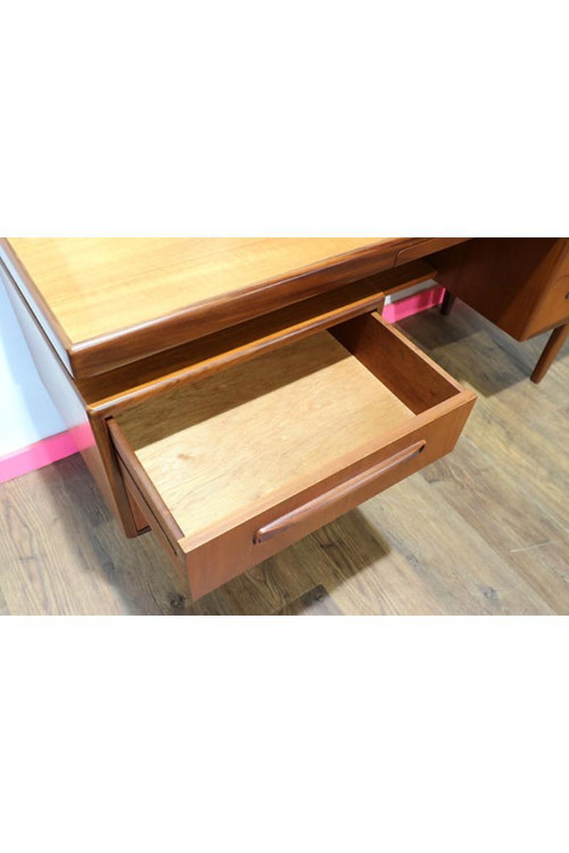 This classic Fresco desk/vanity designed by VB Wilkins for G Plan is a classic vintage style.  It has a slim and organic shape and offers the possibility of storage with two double sets of drawers . The mirror can be adjusted forwards and backwards