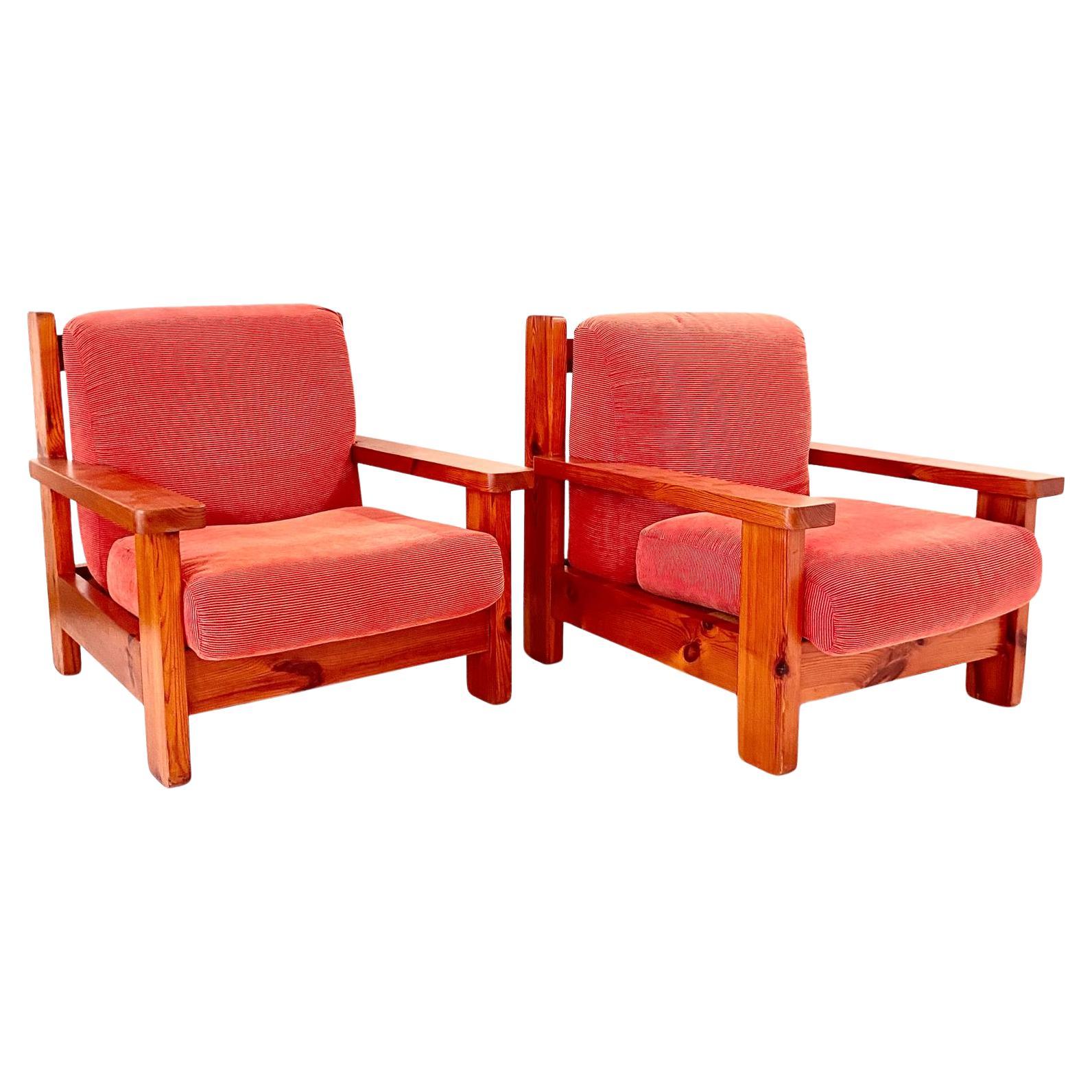 Two Mid Century Modern Vintage Wood and Red Velvet Armchairs

This pair of vintage armchairs, crafted in Italy in the 1970s are made of solid wood armchairs feature a robust and sturdy frame made from high-quality spruce, showcasing a meticulously