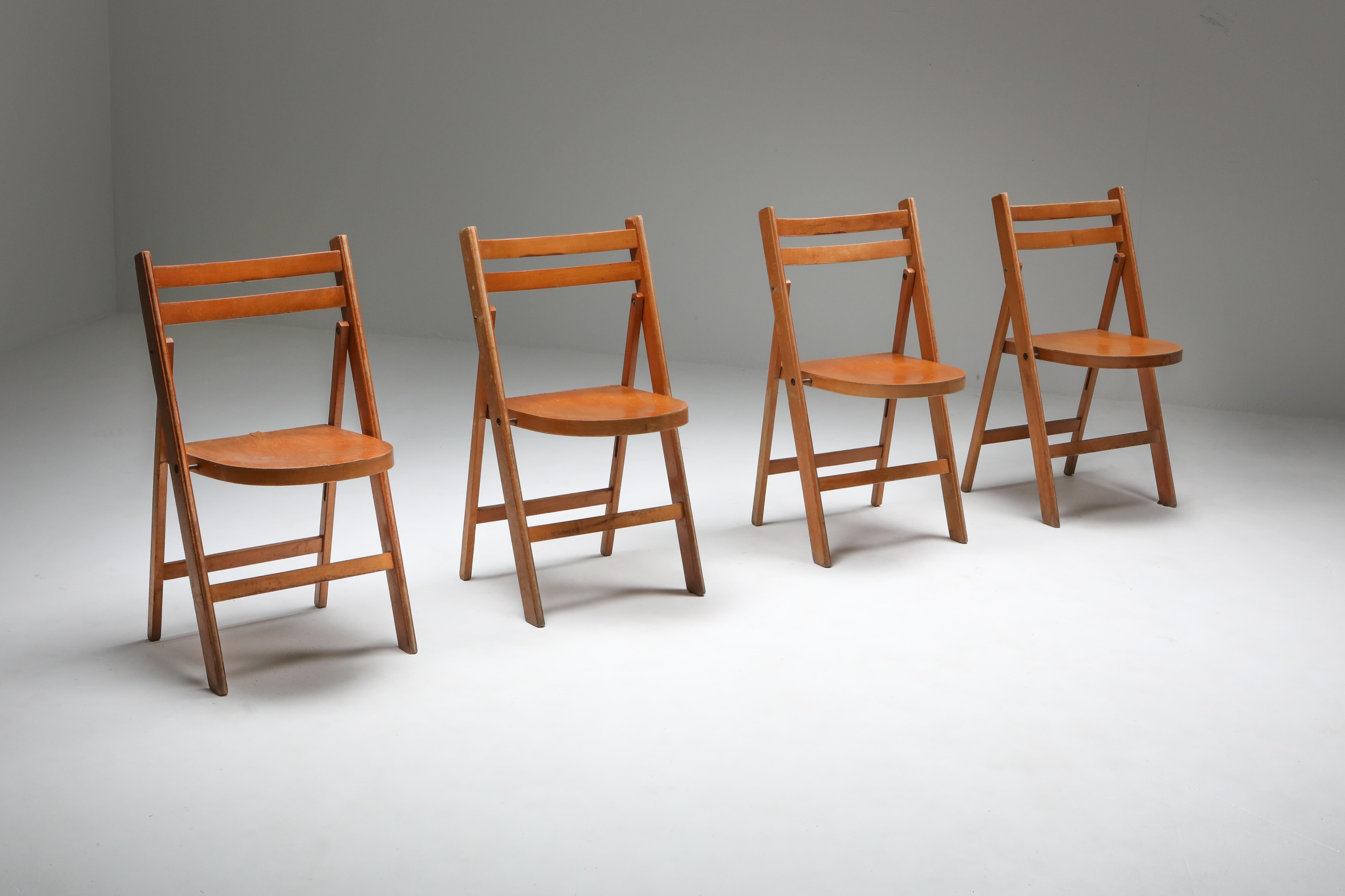 Vintage 1950s Dutch folding chairs in beech with brass details
A great Mid-Century Modern set 
they are stackable which make them ideal for restaurants, bar or events
30 pieces available
Price per piece.
 