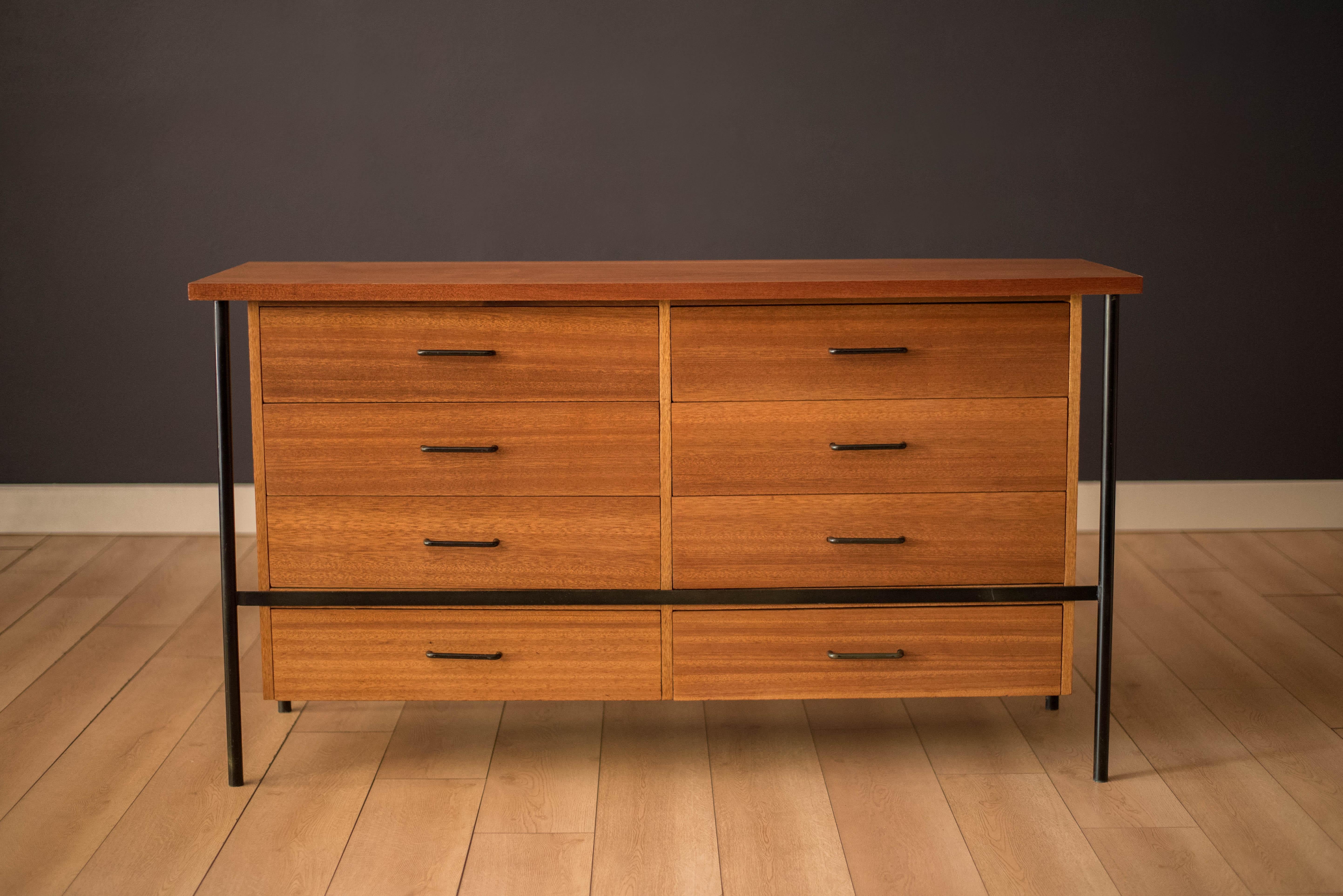 Vintage double dresser in mahogany designed by Don Knorr for Vista of California circa 1950's. This unique piece offers plenty of storage including eight dovetailed drawers supported by a heavy steel frame accented with the original black hardware.