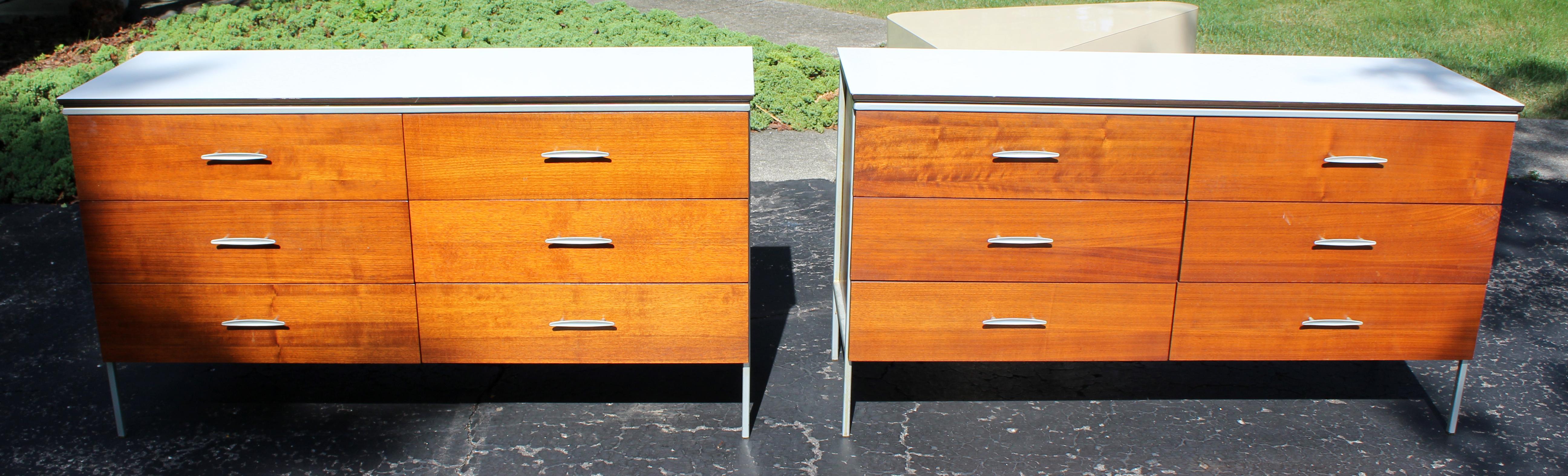 For your consideration is a wonderful pair of wood dressers, with formica tops and six drawers each, by Vista, in the style of Knoll and Paul McCobb, circa 1960s. In very good condition. The dimensions are 54