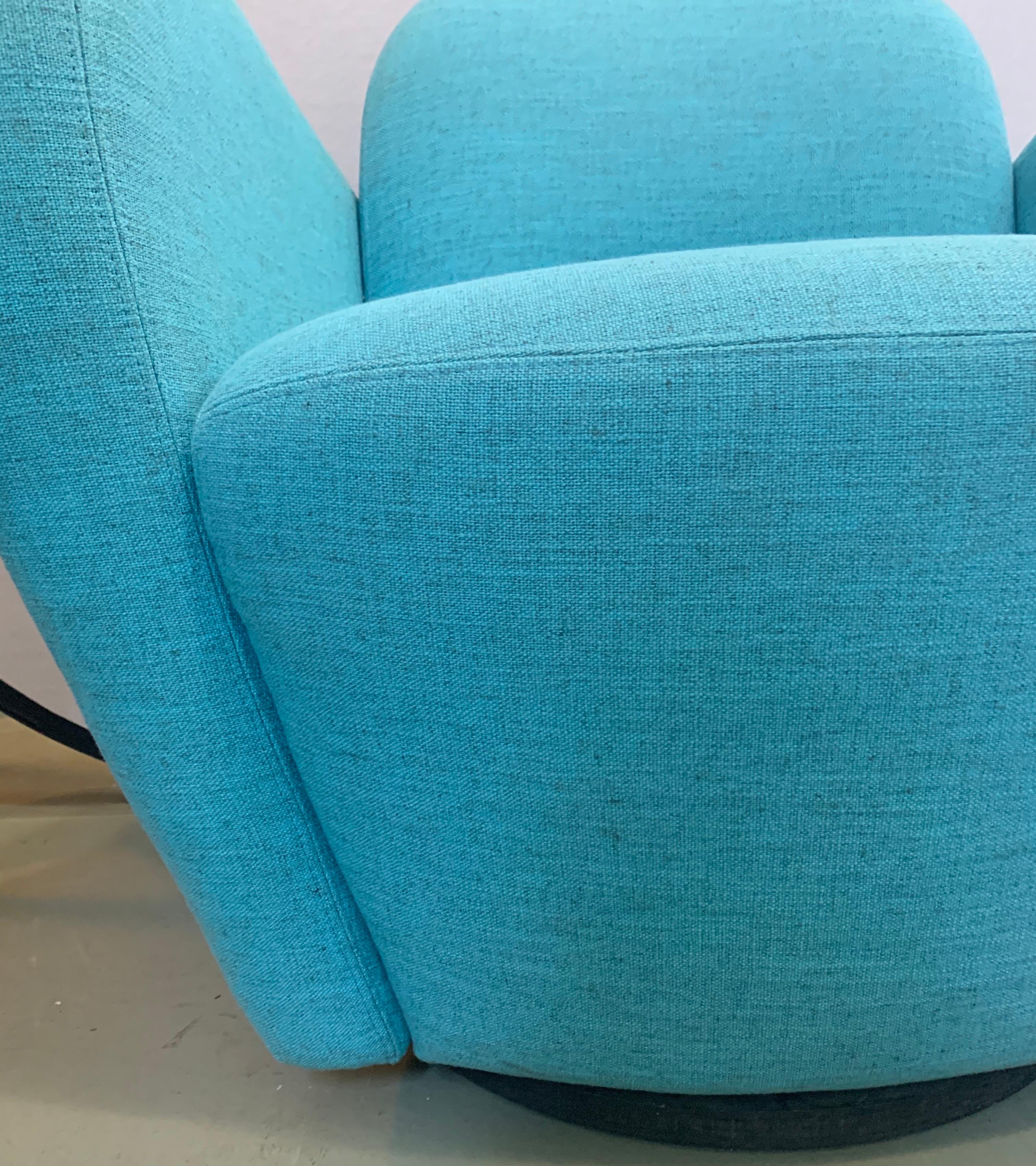 Iconic midcentury, great scale and better lines comes with this swivel lounge chair made by Weiman. The fabric was reupholstered recently and done in a vibrant turquoise blue. Now, more than ever, home is where the heart is.