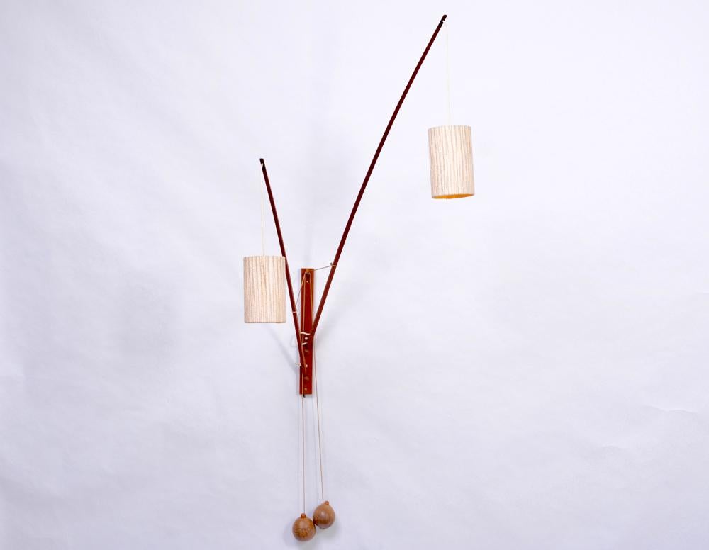 Very rare double wall lamp made of Teak wood designed by Rupprecht Skrip and produced in Germany, circa 1950s-1960s by Skrip Leuchten. The two Teak rods of different lengths can be moved individually and allow multiple ways of light positioning