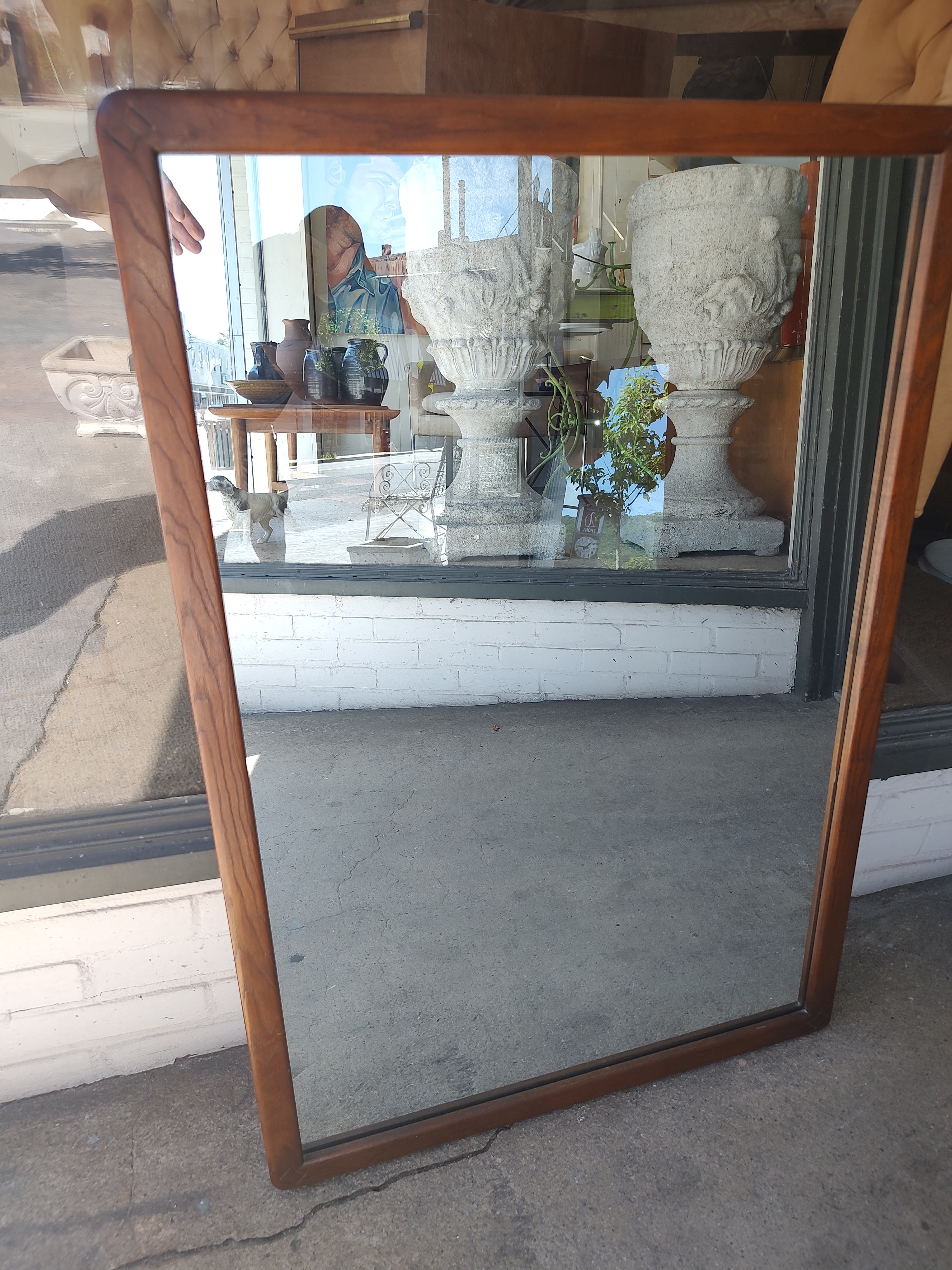Elegant and simple oak framed mirror with bow tie corners. In excellent vintage condition with minimal wear. Can be parcel posted.