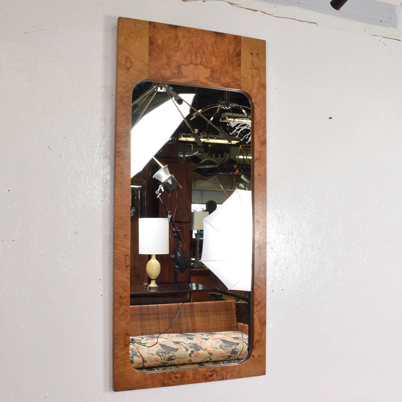 For your consideration, Mid-Century Modern wall mirror in burl wood by Milo Baughman.

The USA circa the 1970s.
Dimensions: 47