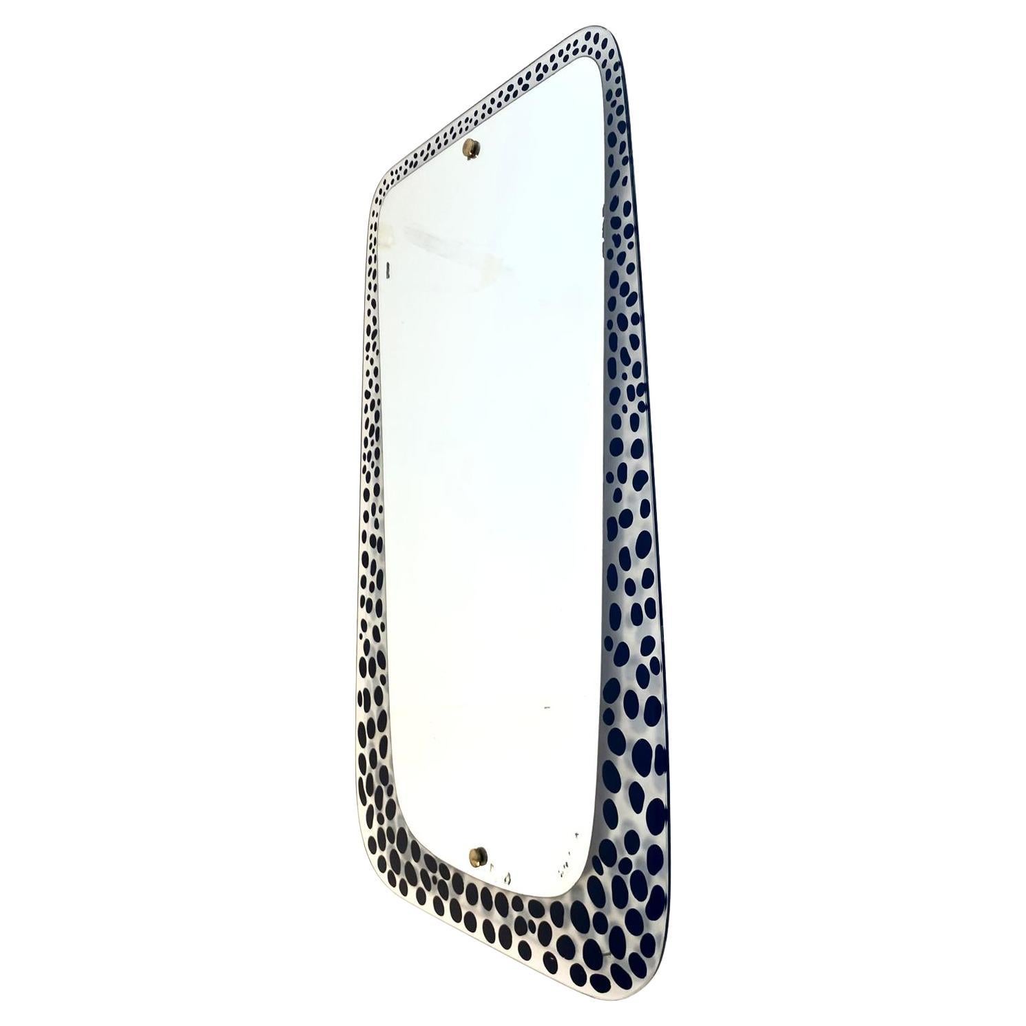 Mid-Century Modern Wall Mirror with Polka Dot Pattern – Italy, 1960s

This rare and charming frameless wall mirror, crafted in Italy during the 1960s, features a striking black and white polka dot pattern that adds a playful yet sophisticated touch