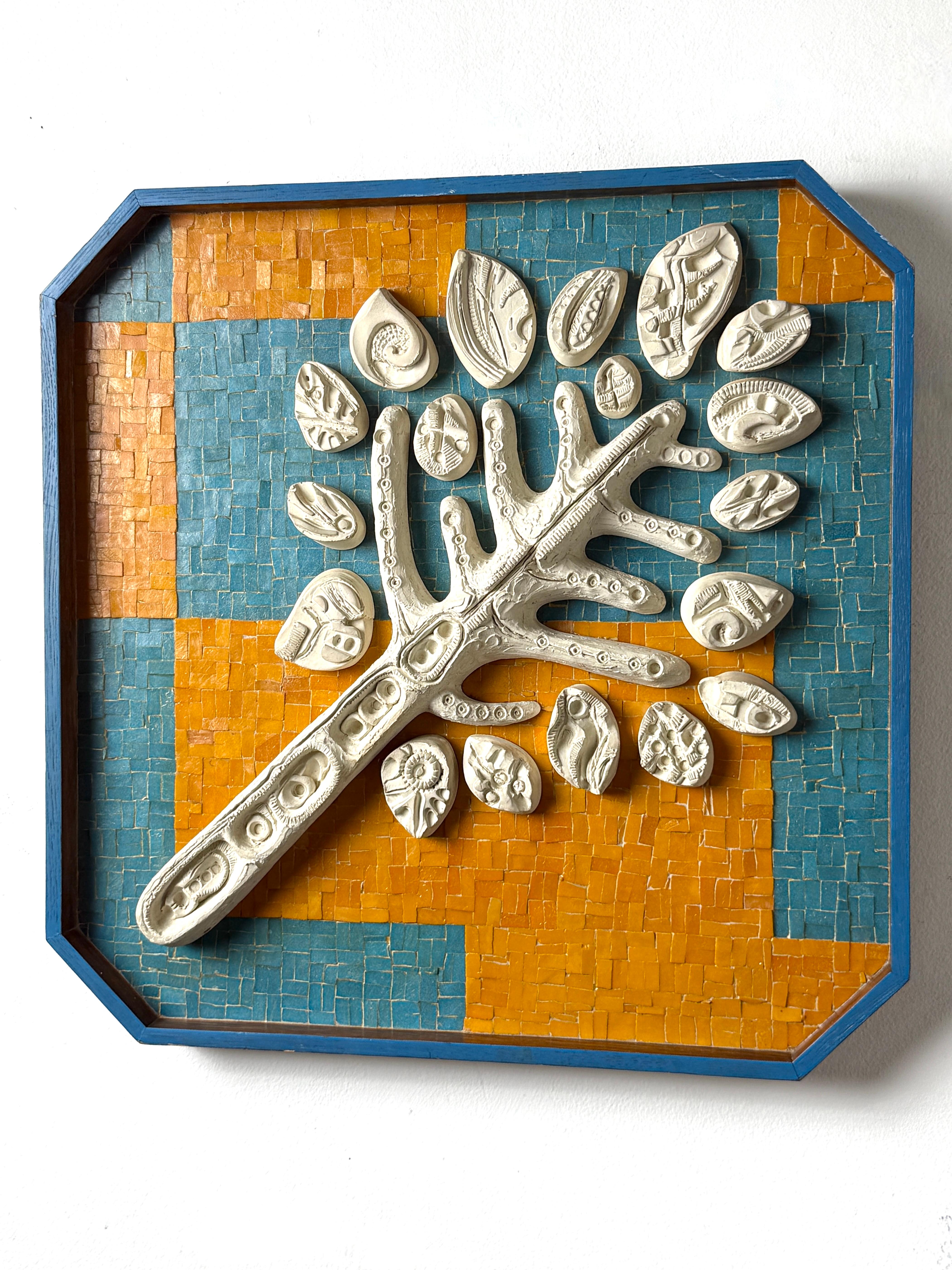 Unique Mid Century modern framed abstract mosaic wall hanging sculpture
USA 1969

Modernist white ceramic tree with textured leaf and branch reliefs 
Set against a tessellated glass mosaic in orange and blue

Recessed within a faceted hardwood frame