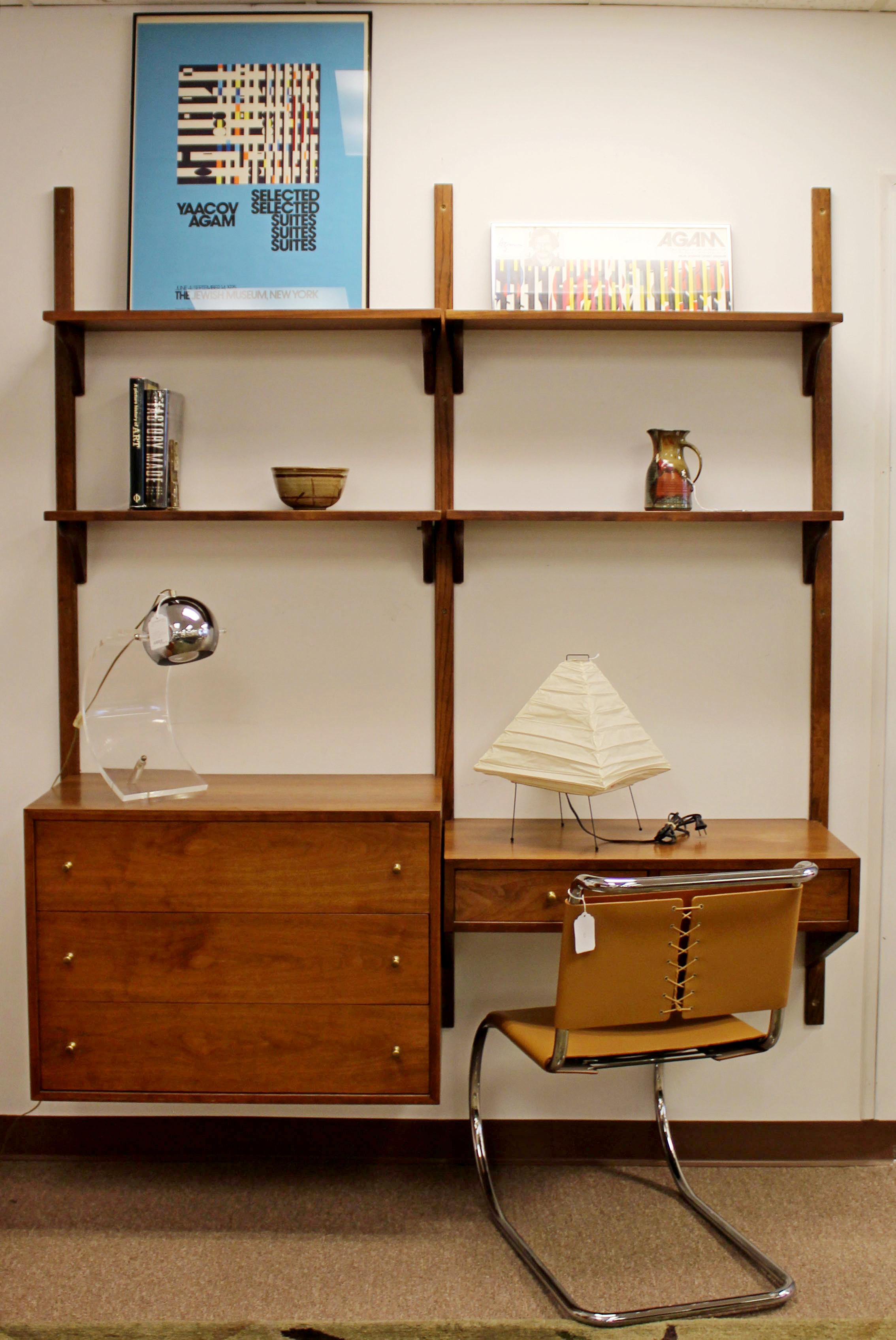 For your consideration is a magnificent, wall mounted, modular corner cabinet with shelves, drawers and a desk, circa 1960s. In very good condition. The dimensions are 66