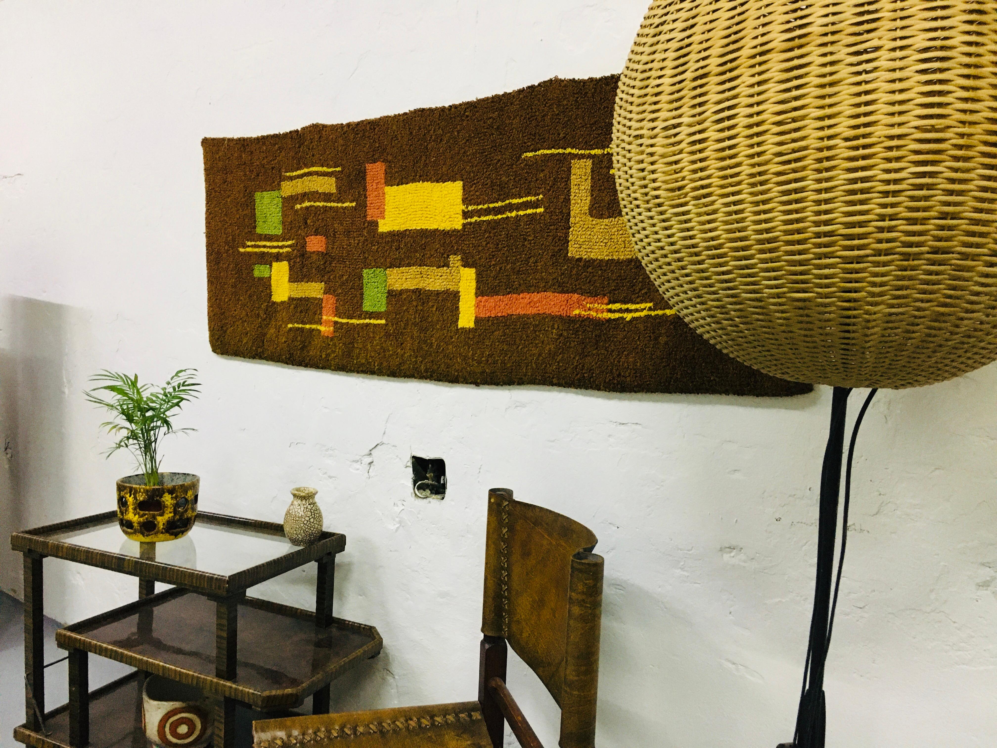 Modern wool tapestry from the 1970s, with a coffee brown base and a lively non-figurative pattern, a great decoration for both vintage and modern rooms. Tear- and wear-free condition.