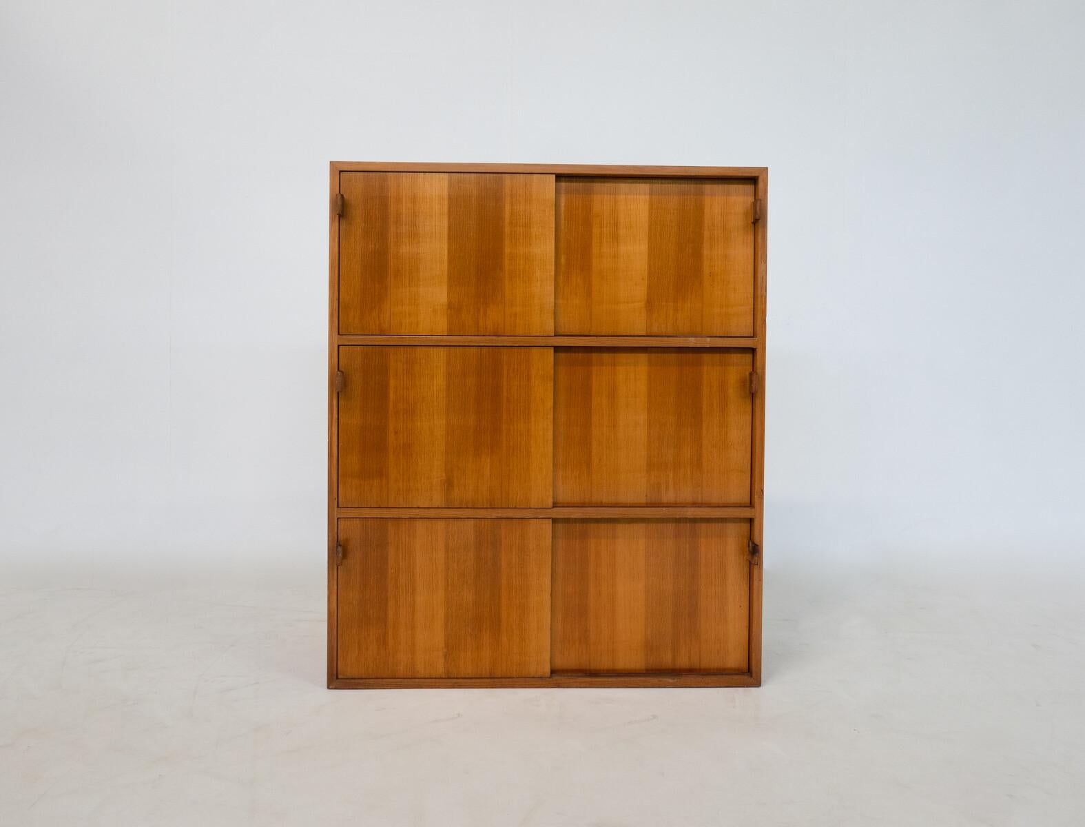 Mid-Century Modern wall unit by florence knoll, wood and leather, 1960s.