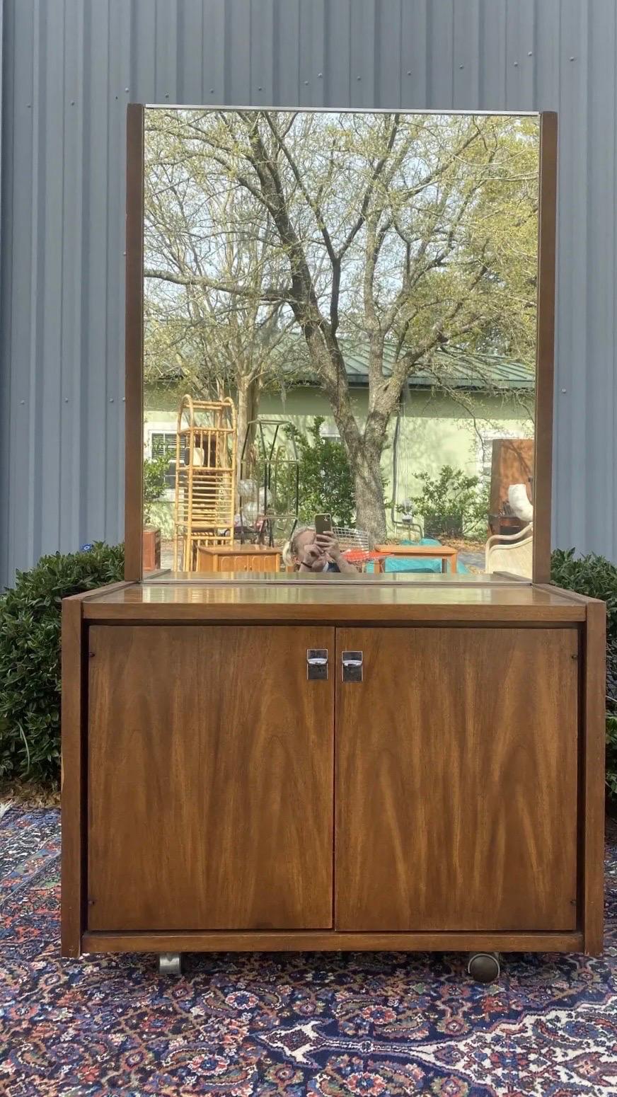 An absolutely gorgeous pair of matching chests with chrome hardware. One is a 4 drawer commode chest and the other is a double door cabinet front that opens up to reveal 3 spacious drawers that slide out. Made in the 1960’s by United Furniture