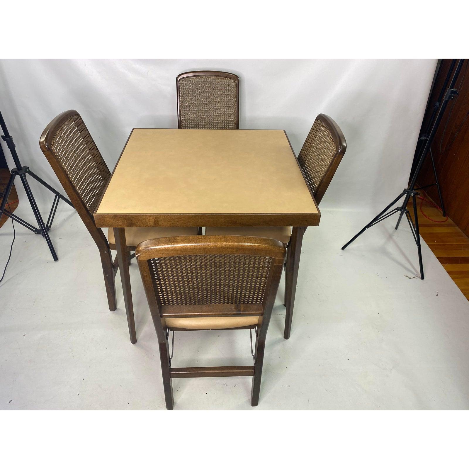 Mid-Century Modern walnut and vinyl folding games table set, Circa 1960s - 5 pieces
Table measurements are: H: 28 1/2”. W: 30” D: 30” 
Seat Height: 18