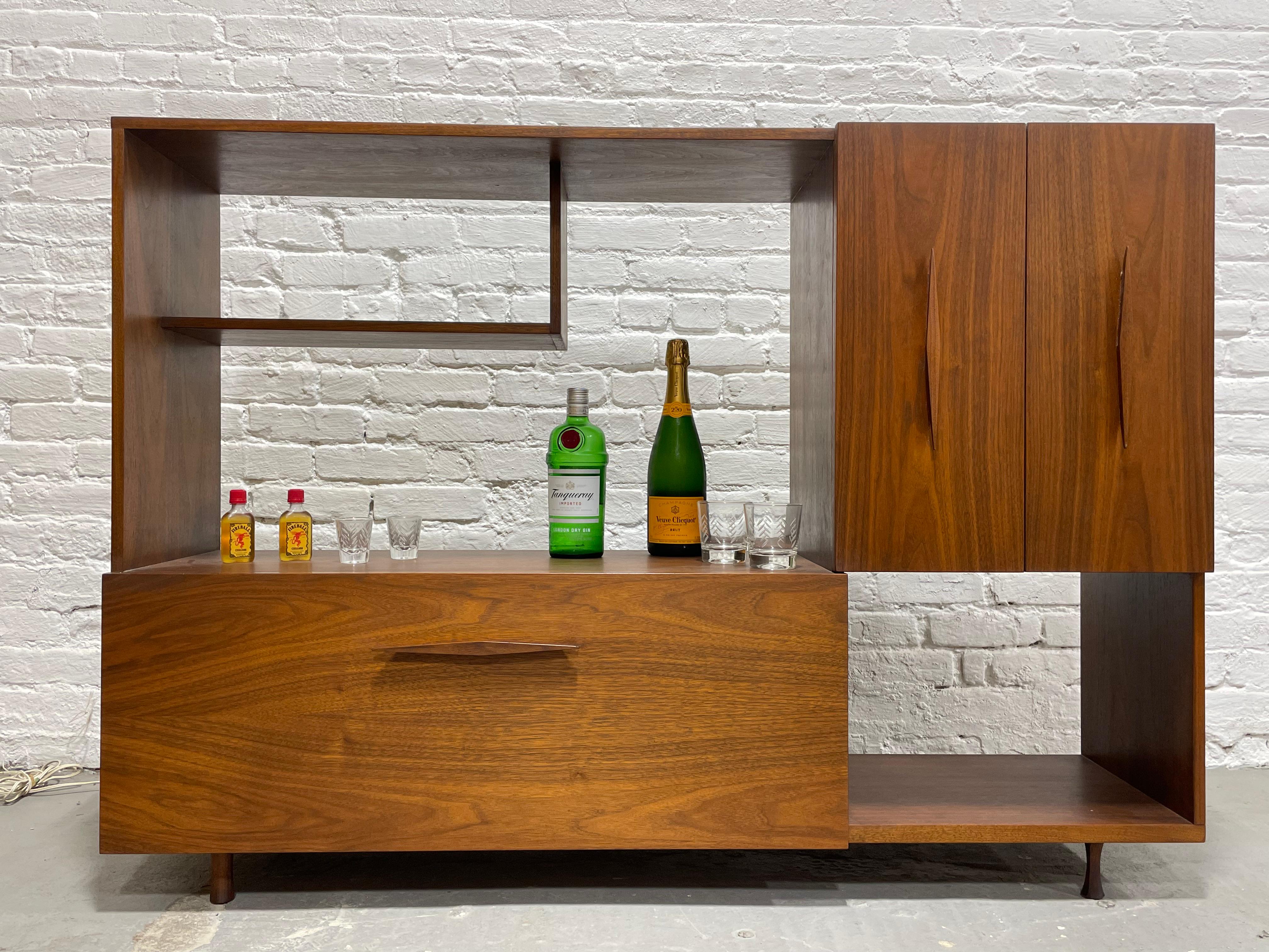 Super Fun Mid Century Modern Walnut Bar / Bookcase / Cabinet, c. 1960's.   This stately bar offers plenty of room for your liquor collection, glasses and anything else you need for the funkiest bar ever, including an awesome drop down bar with felt