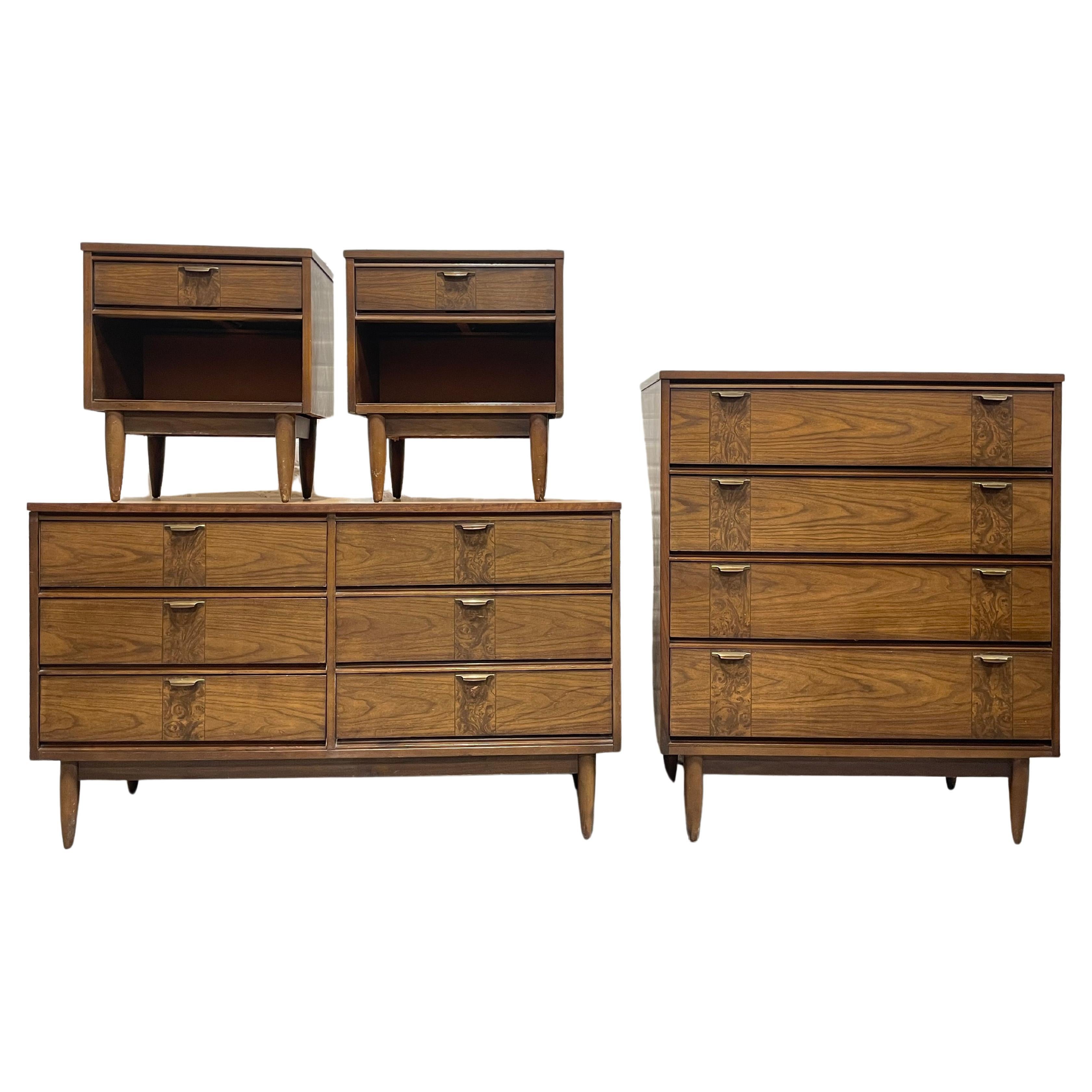 Mid Century Modern Walnut Bedroom Set, c. 1960's. This magnificent set consists of a long dresser, tall dresser and pair of nightstands. Each piece is highlighted by a decorative design along the drawer facade, tapered legs and solid and sturdy
