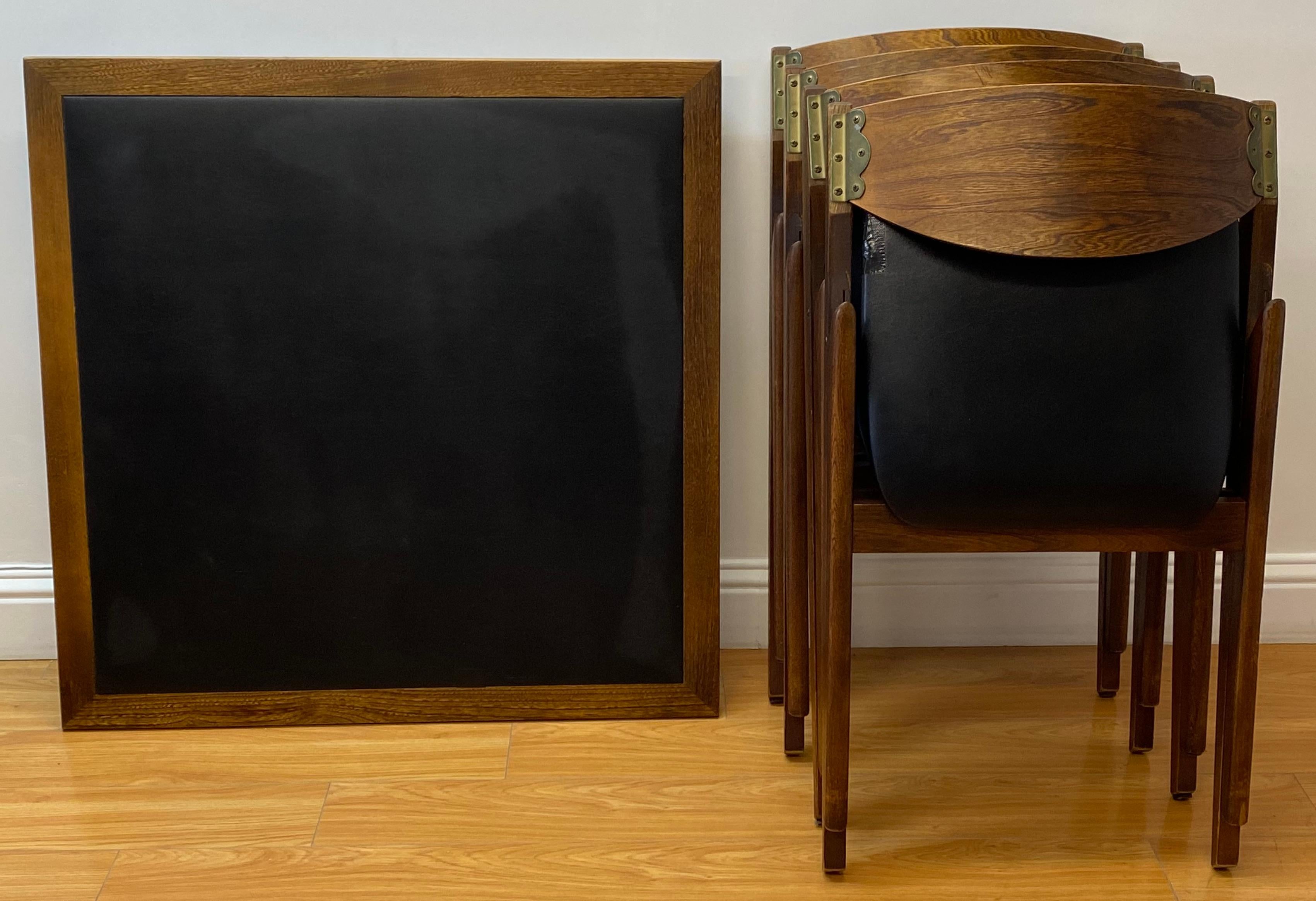 Mid-Century Modern walnut and black vinyl folding games table set, circa 1960

The table is made in Norway and the chairs are made in New York

As far as we can tell this is a matching set

Table dimensions 34
