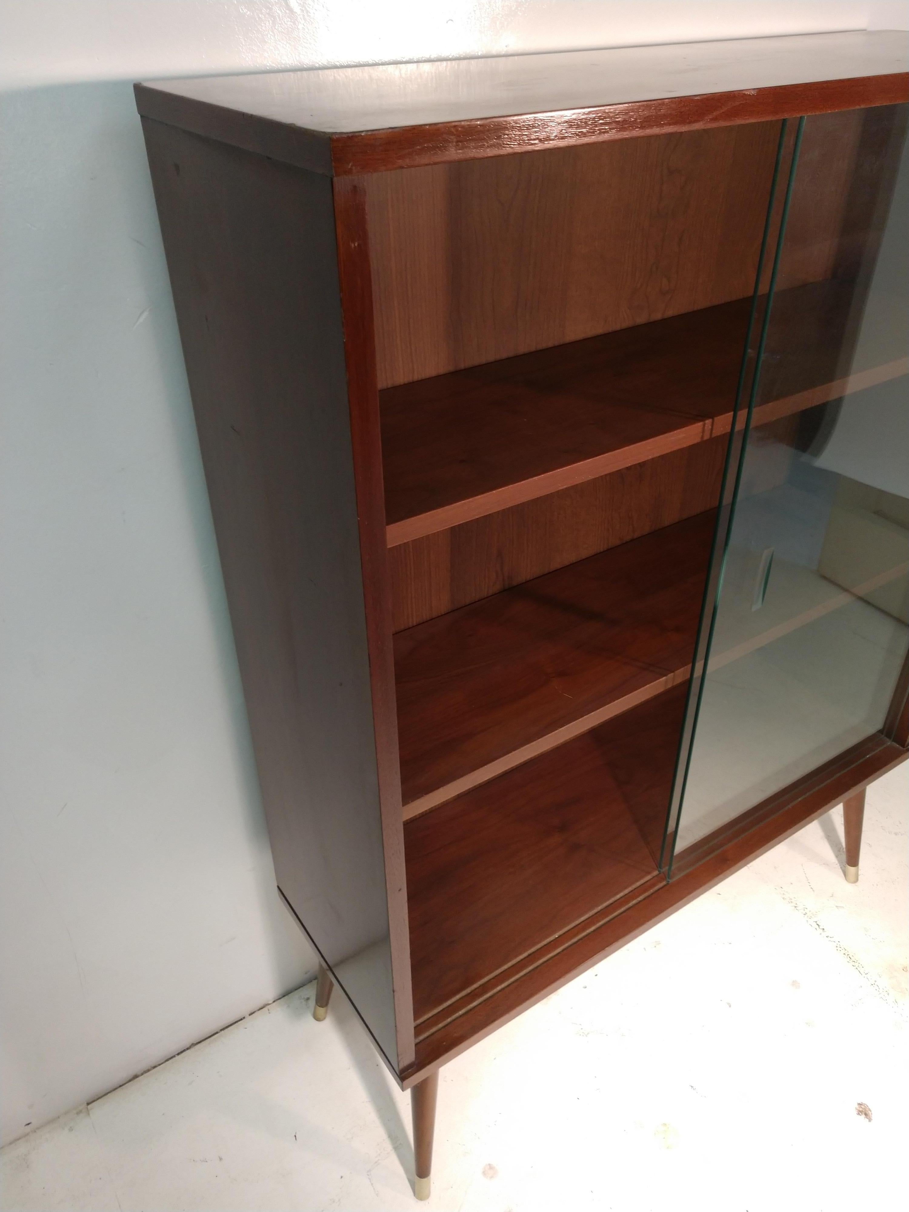 mid century modern bookcase with glass doors