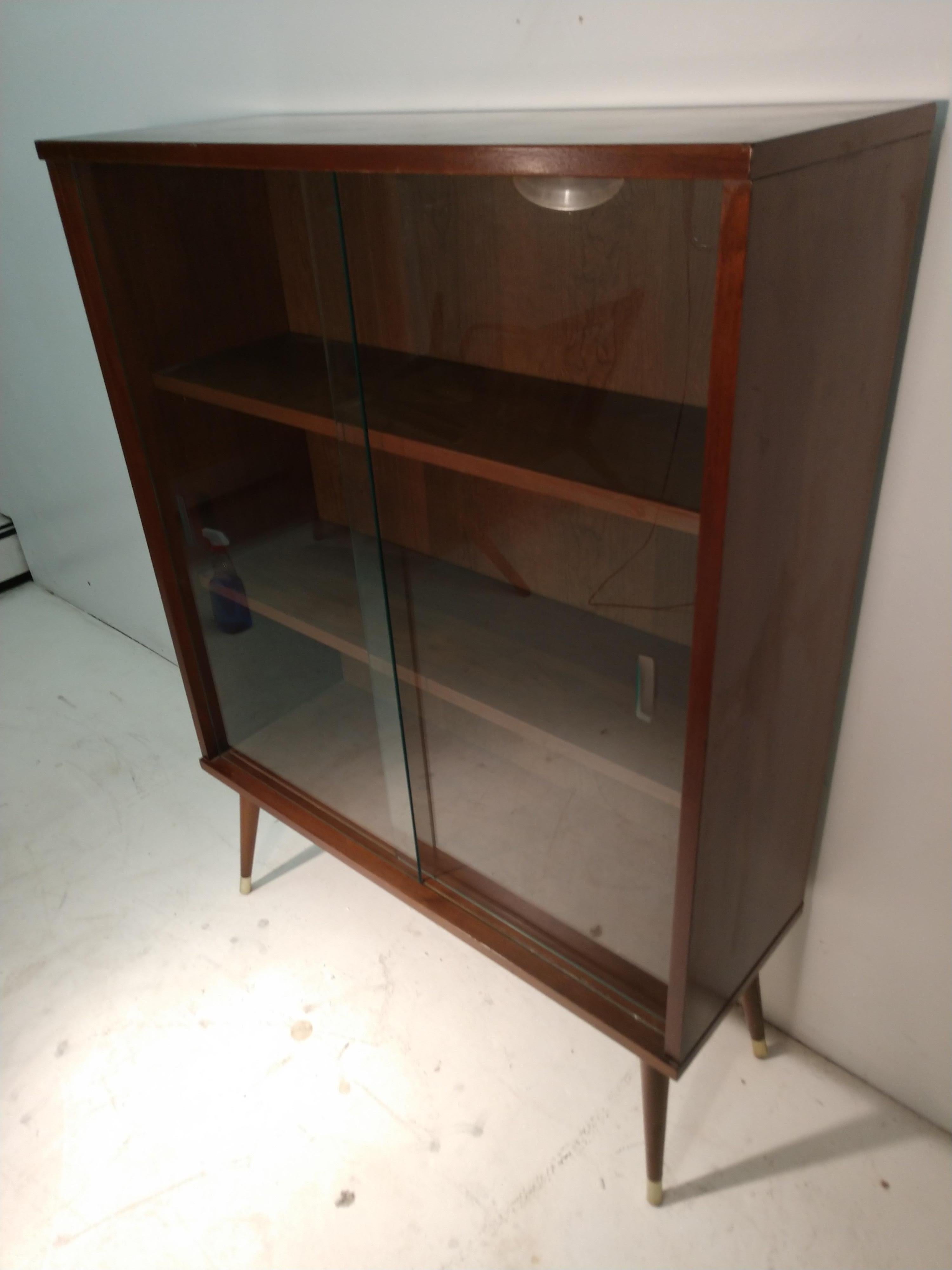 American Mid-Century Modern Walnut Bookcase with Glass Sliding Doors