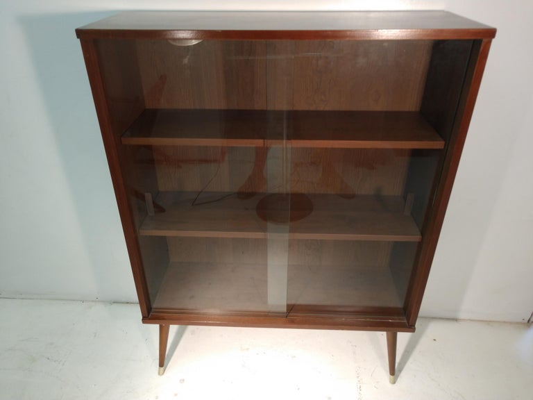 MidCentury Modern Walnut Bookcase with Glass Sliding Doors at 1stDibs
