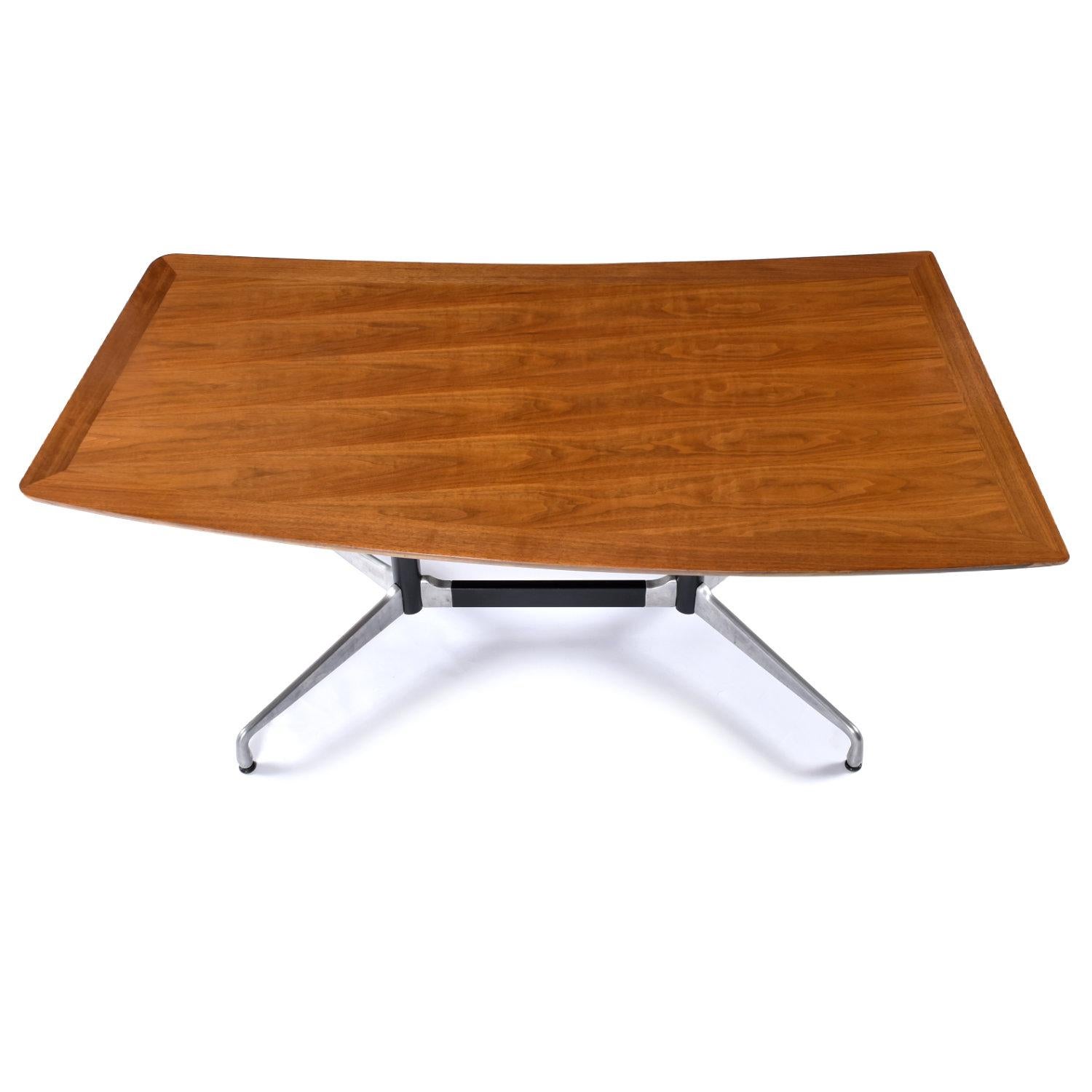 Something old, something new, something borrowed… but it’s not blue. This Mid-Century Modern boomerang desk is a new creation made from vintage parts. The restored Mid-Century Modern boomerang table top has been married to an authentic Eames table