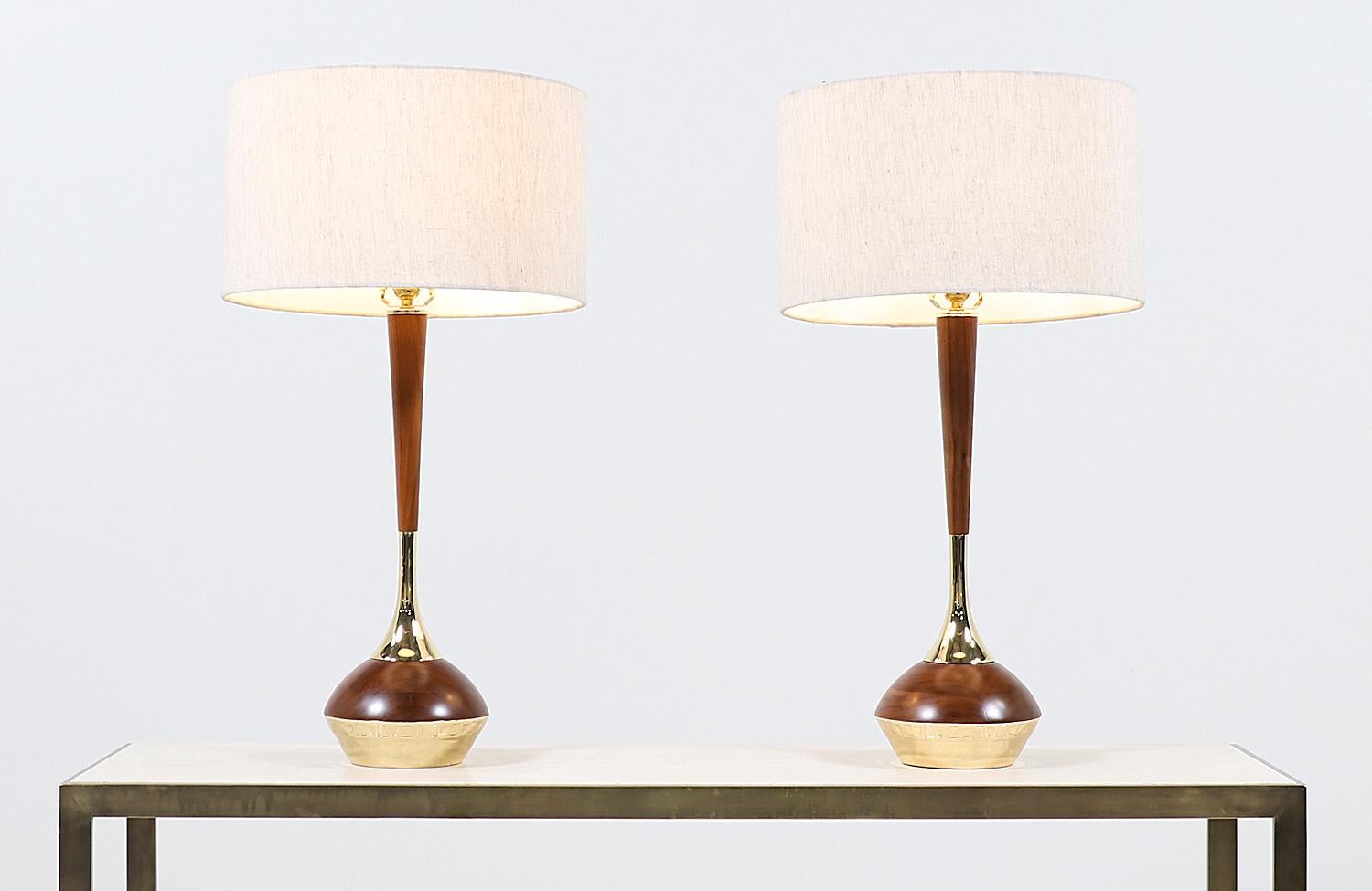 Mid-Century Modern walnut & brass accent table lamps by Laurel


Dimensions
32in H x 8in W x 8in D
Lamp shade: 10in H x 17in W.