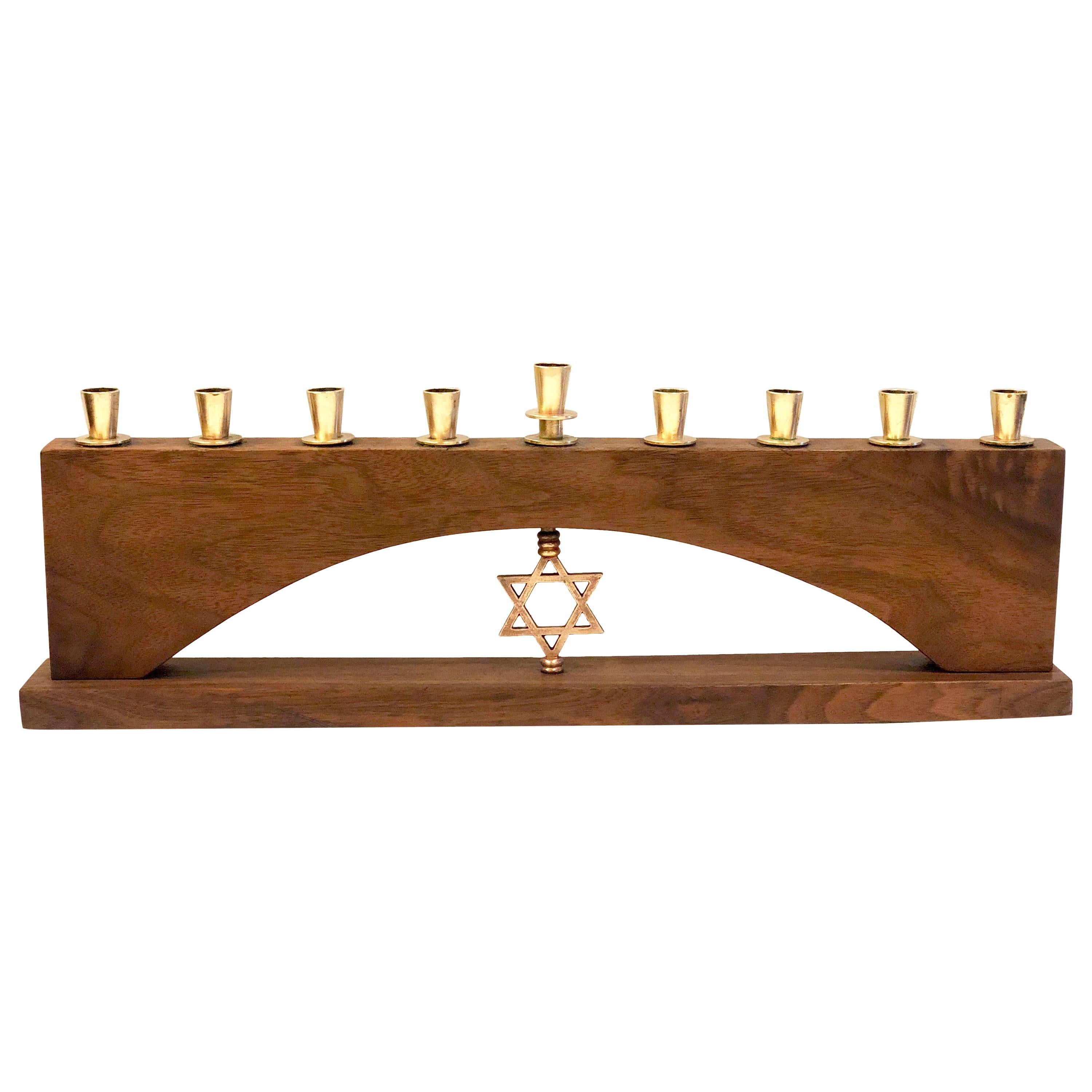 Solid walnut and polished brass candleholders Menorah attributed to Paul Evans, circa 1950s we cleaned and oiled the piece its in nice original condition.