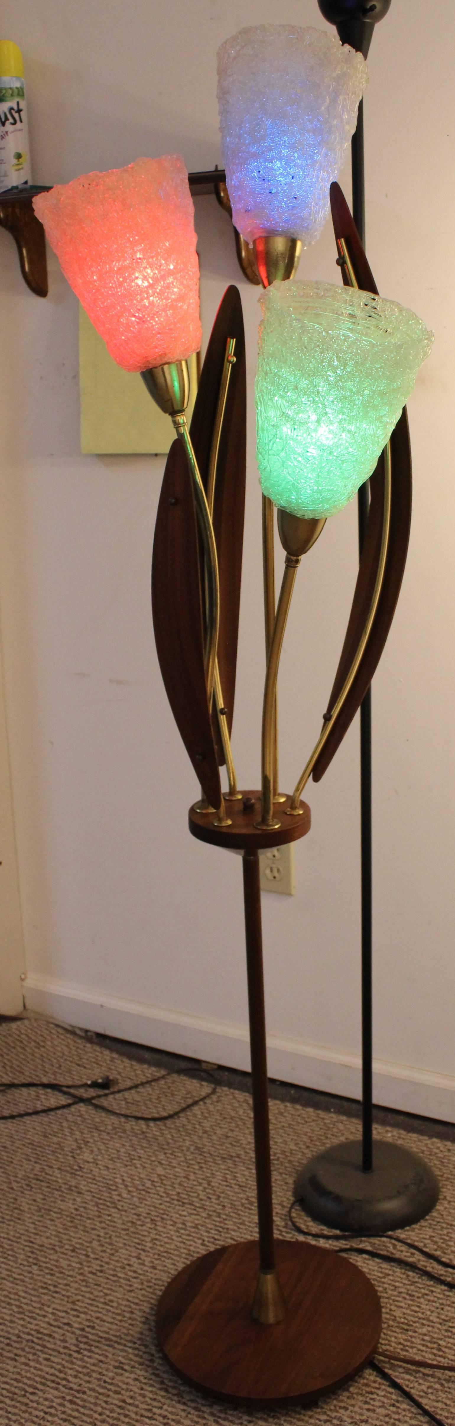 This is a three-way lamp with fiberglass shades and walnut leaves to make the form of a flower. In the pictures, we used colored light bulbs (not included).

Dimensions:
12.5