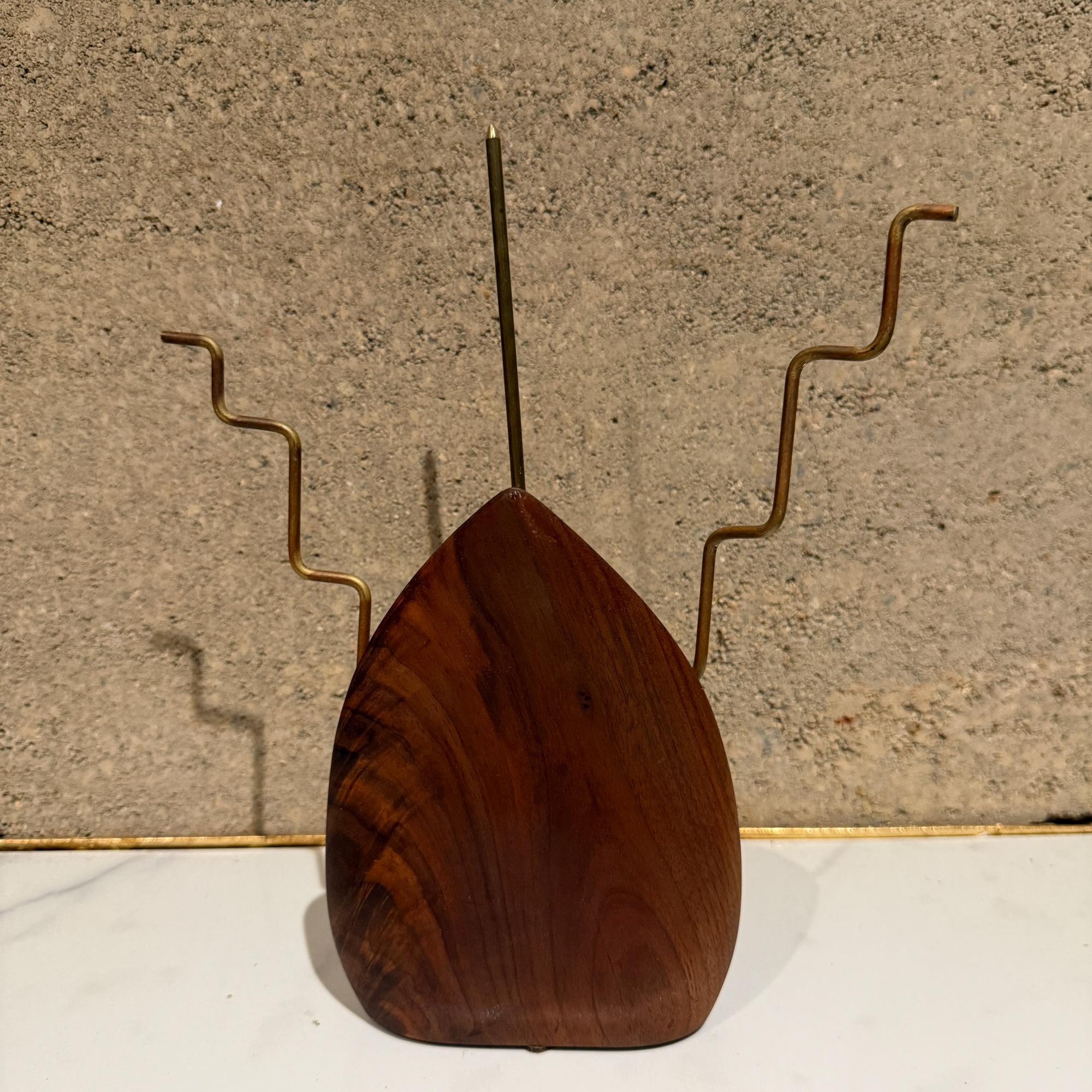 For your consideration a mid-century modern walnut and brass table sculpture, signed G e Redfield. Abstract shape. 

Dimensions: 11.5